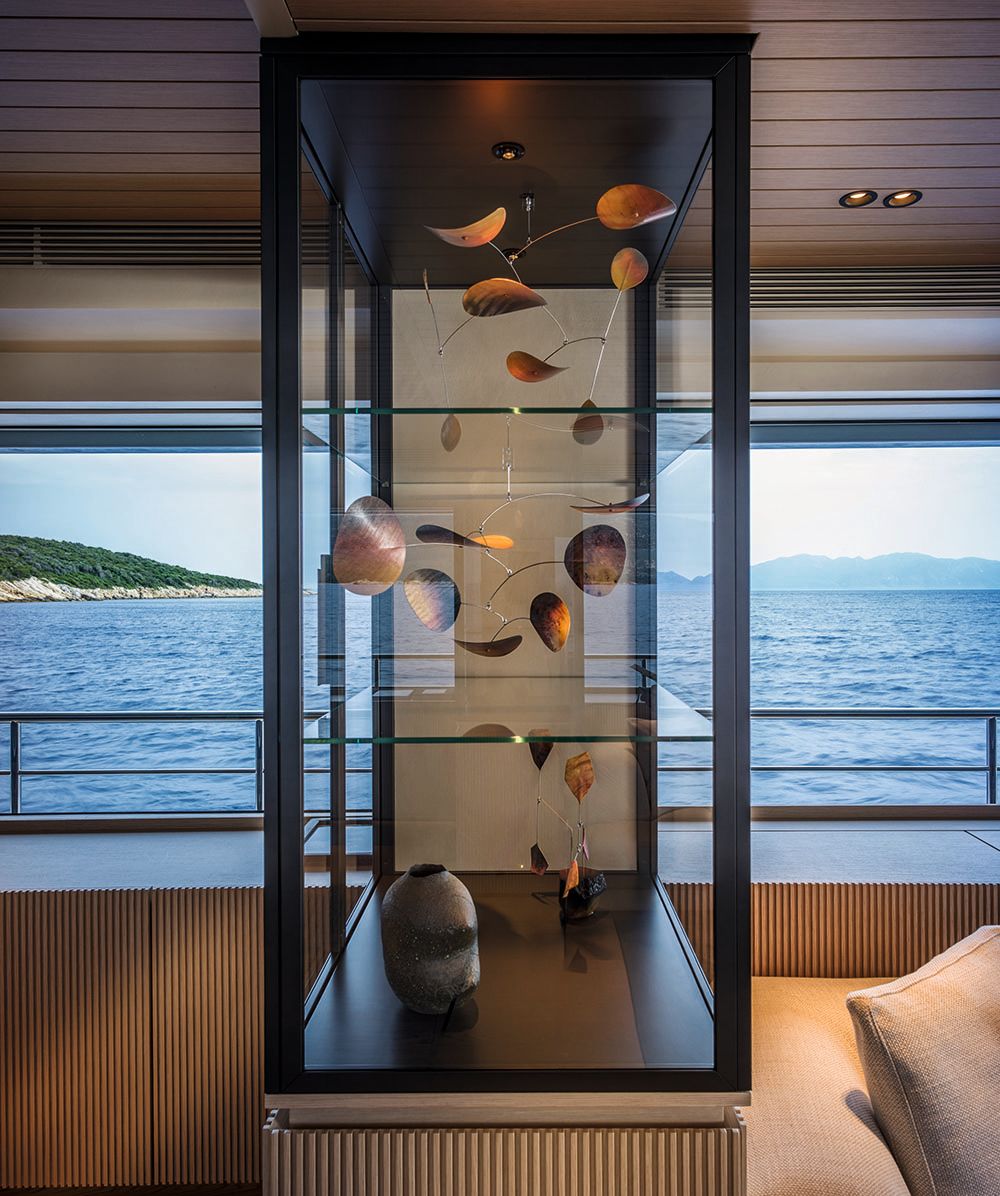 Abstract artworks in a glass cabinet with black frame