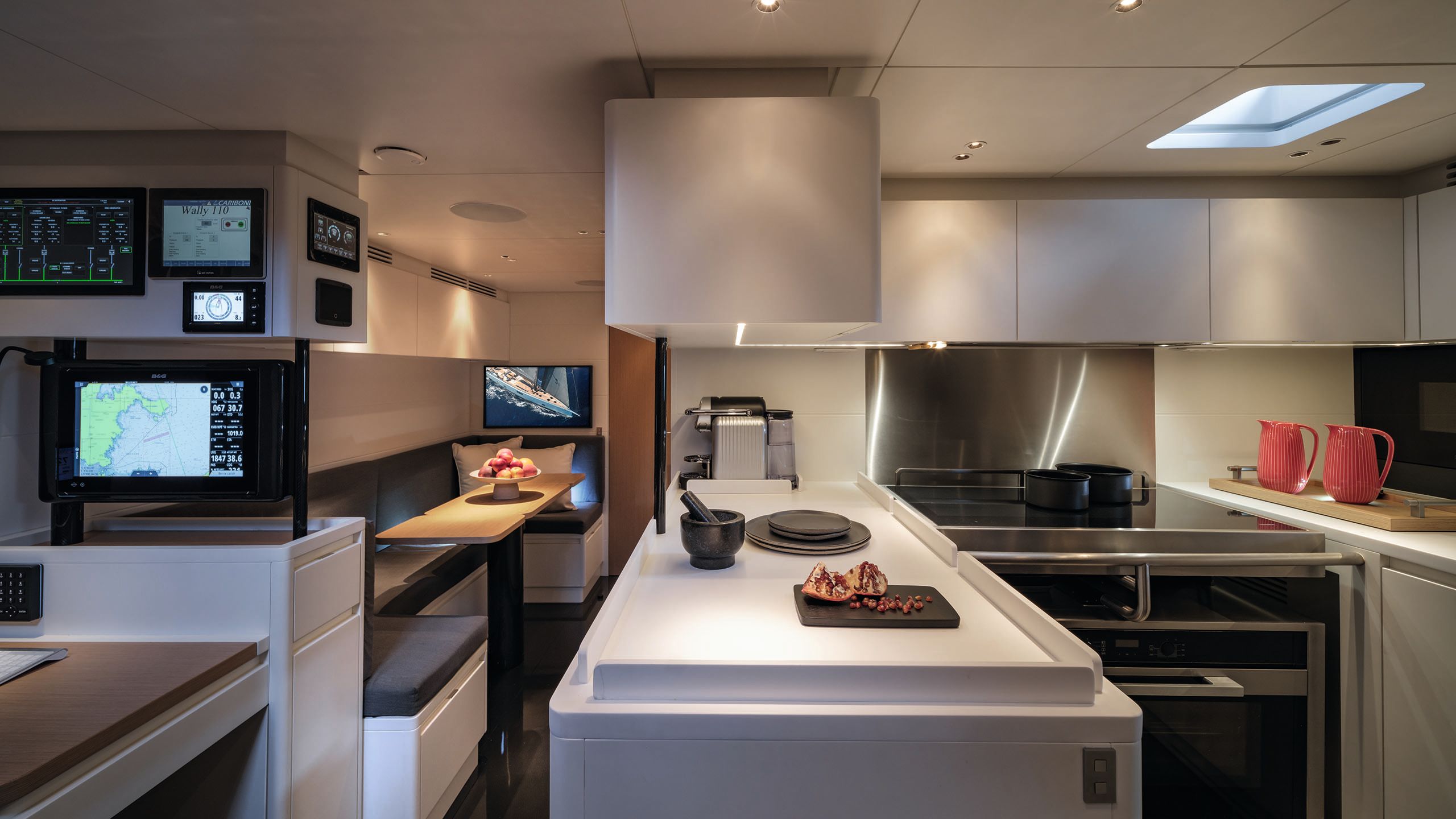 Interior shot of a u-shaped kitchen area in greys and whites