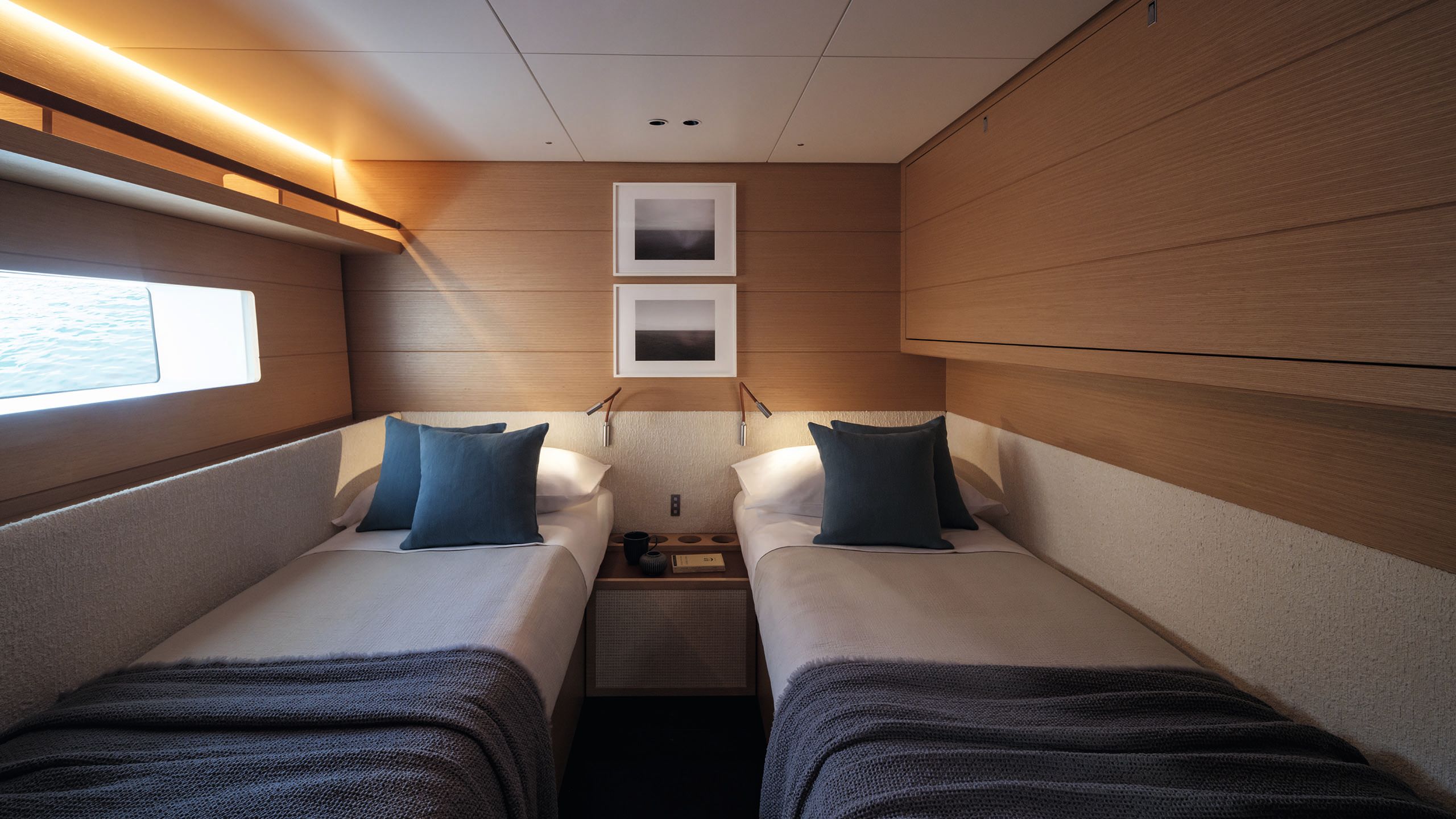 Two single beds either side of a small cabin