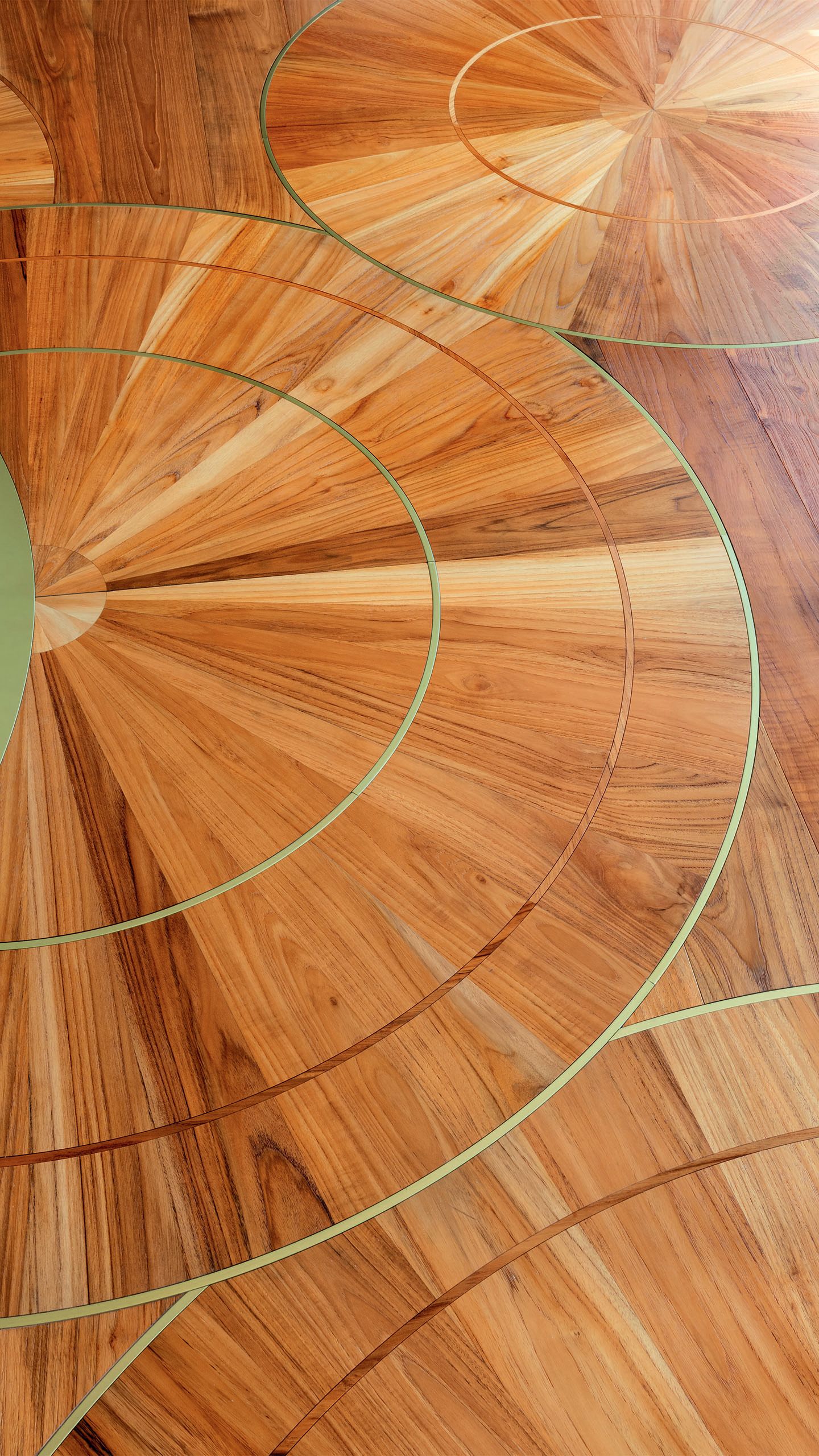 Close-up of the teak floors which have circular inlays