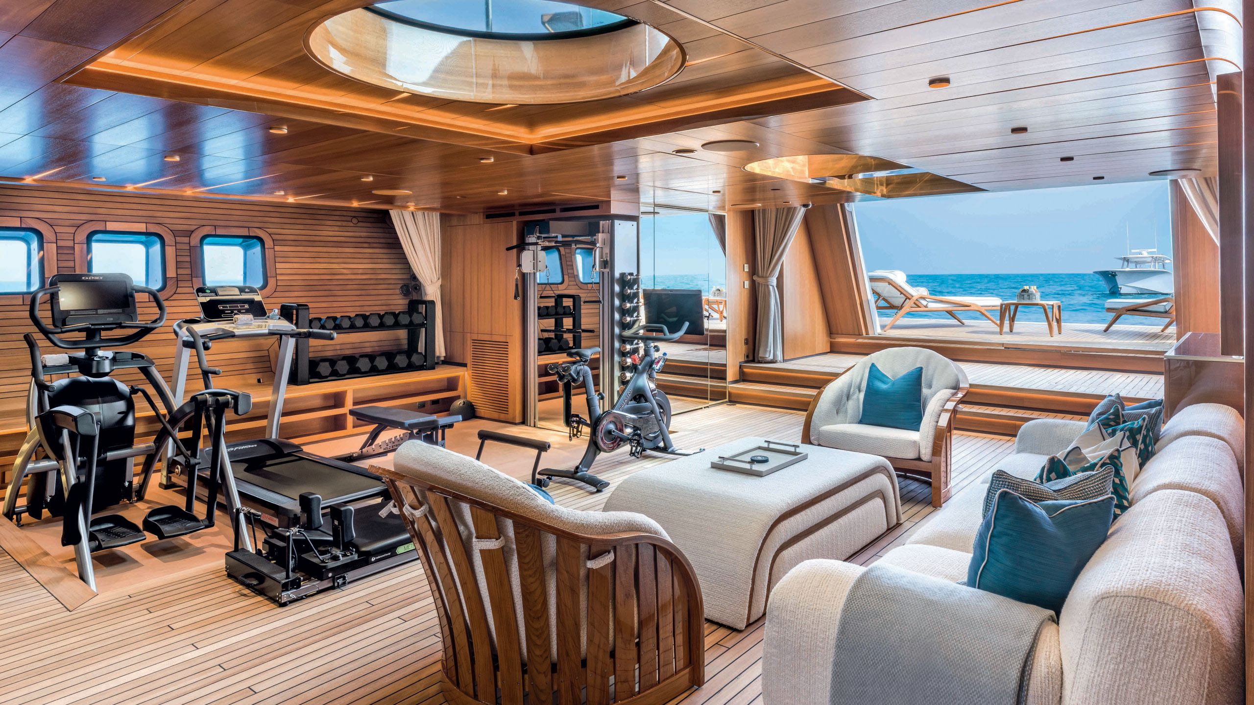 Gym area with equipment and sofa/armchairs