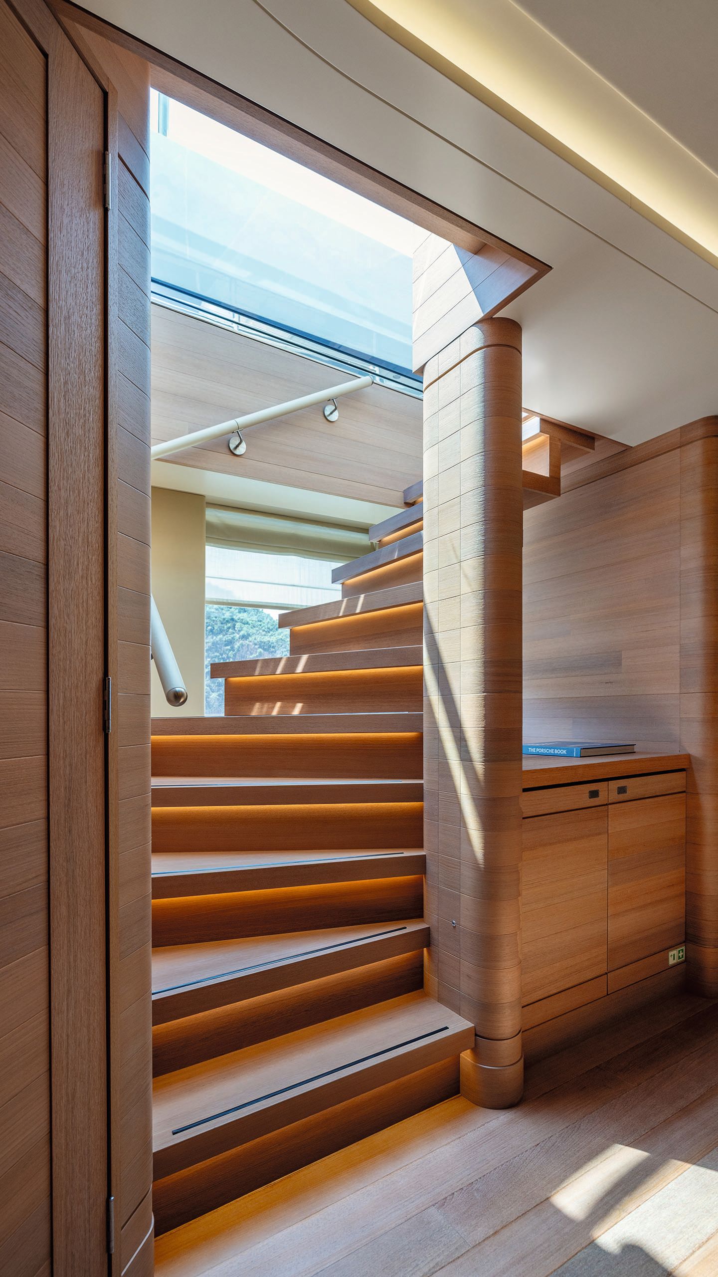 Looking up a staircase to the upper deck from the bottom