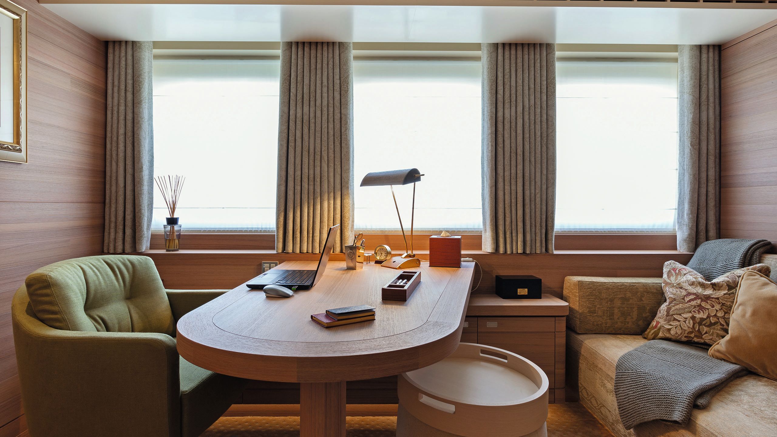 Pre-refit the office had a green chair and neutral sofa