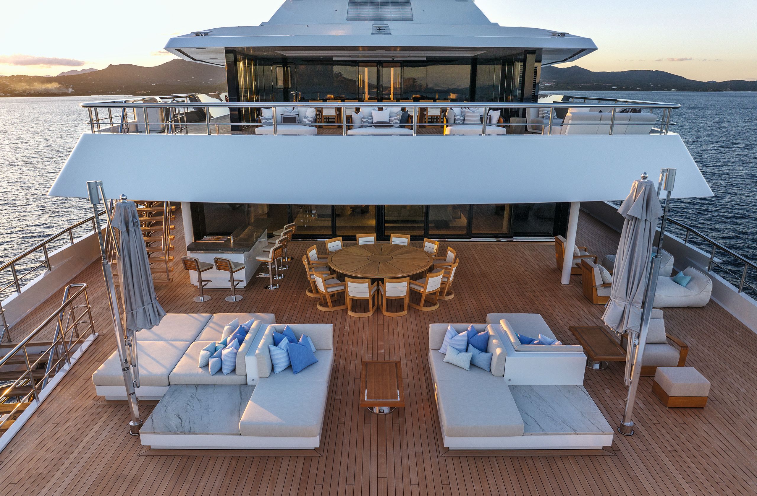 Lower deck beach club showing sunpad loungers and dining area