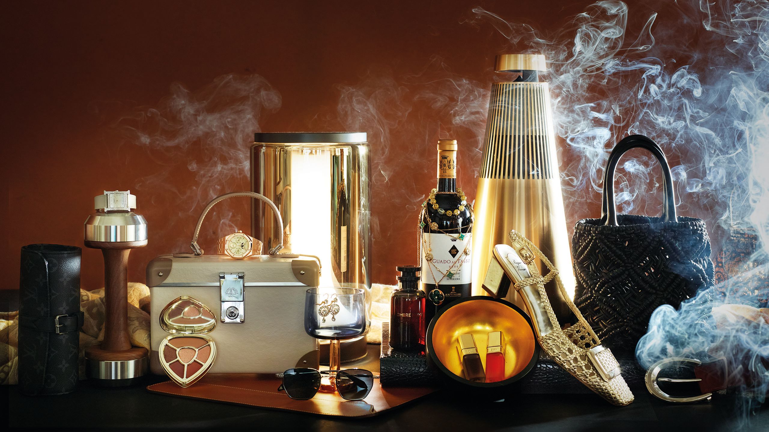 Gifts in a brown and gold palatte, including eyeshadow, a watch, a speaker and slingback pumps