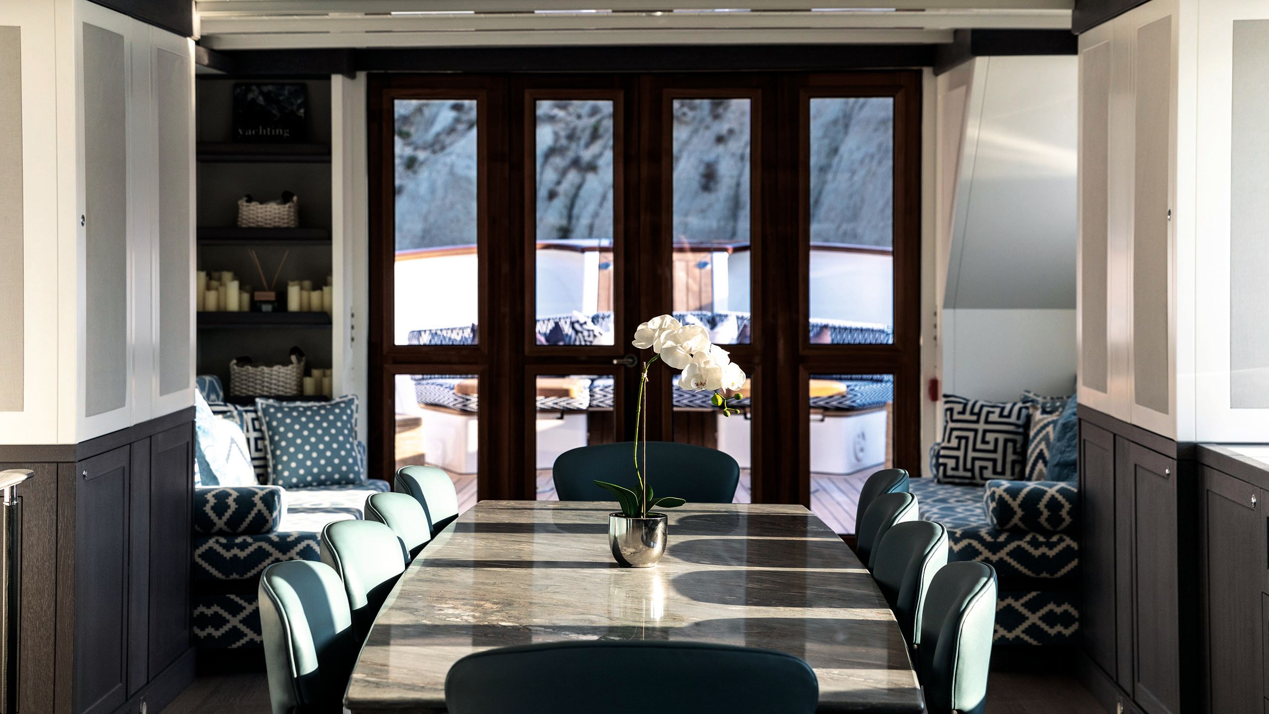 Dining table with chairs and sofa at the end