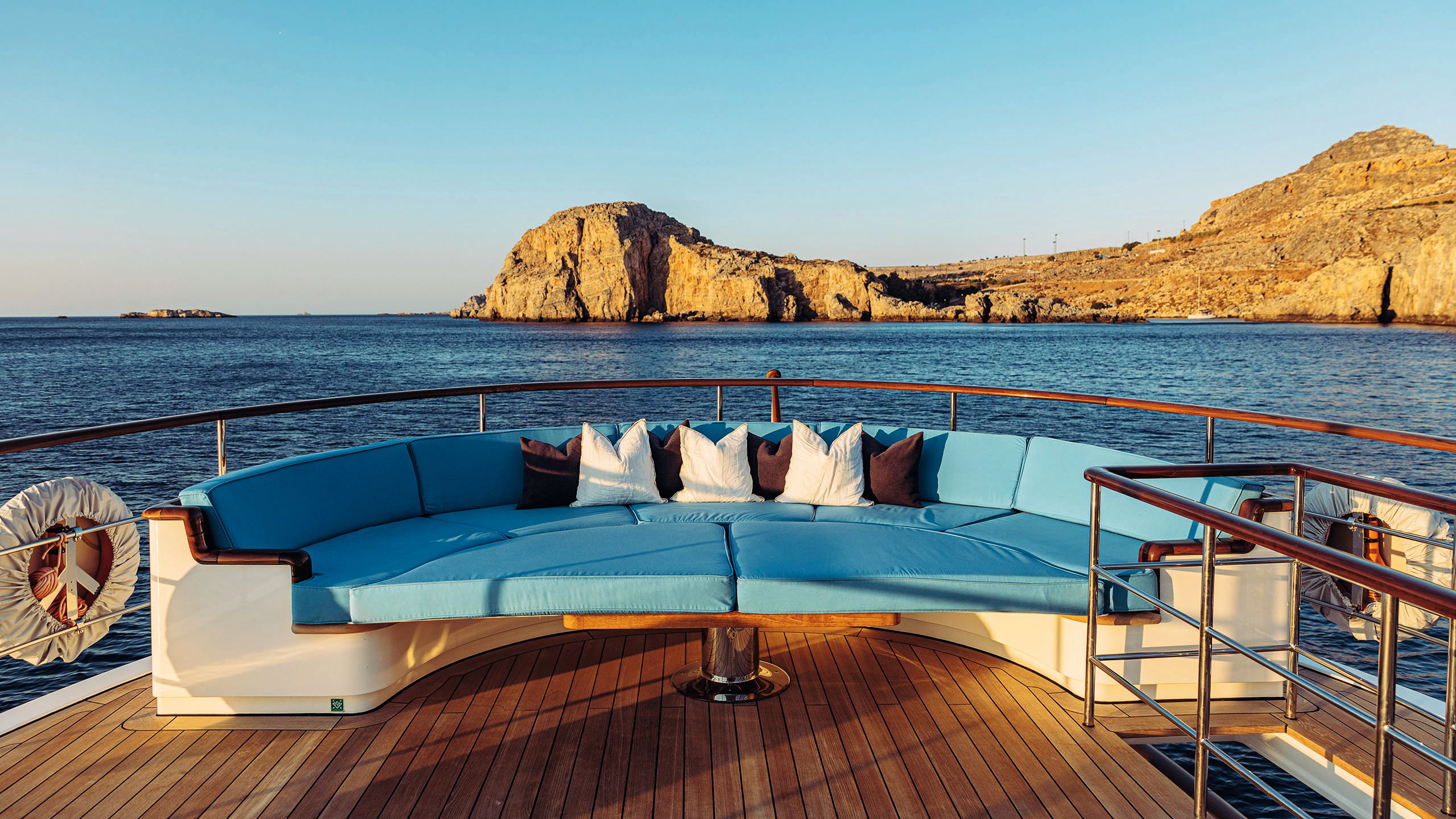 Curved soft seating with turquoise sunpads