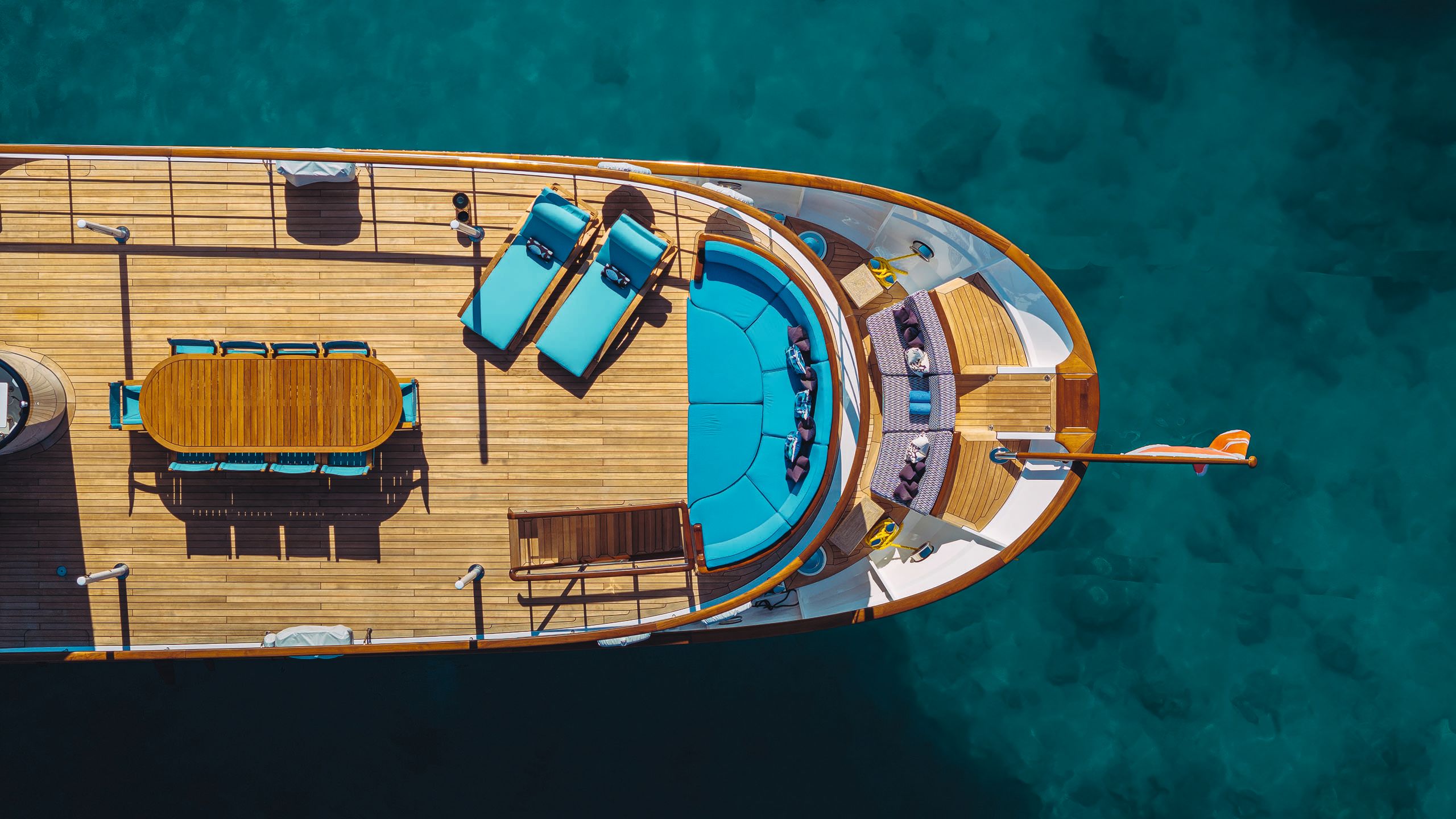 Far Niente from above showing outdoor seating with turquoise cushion pads