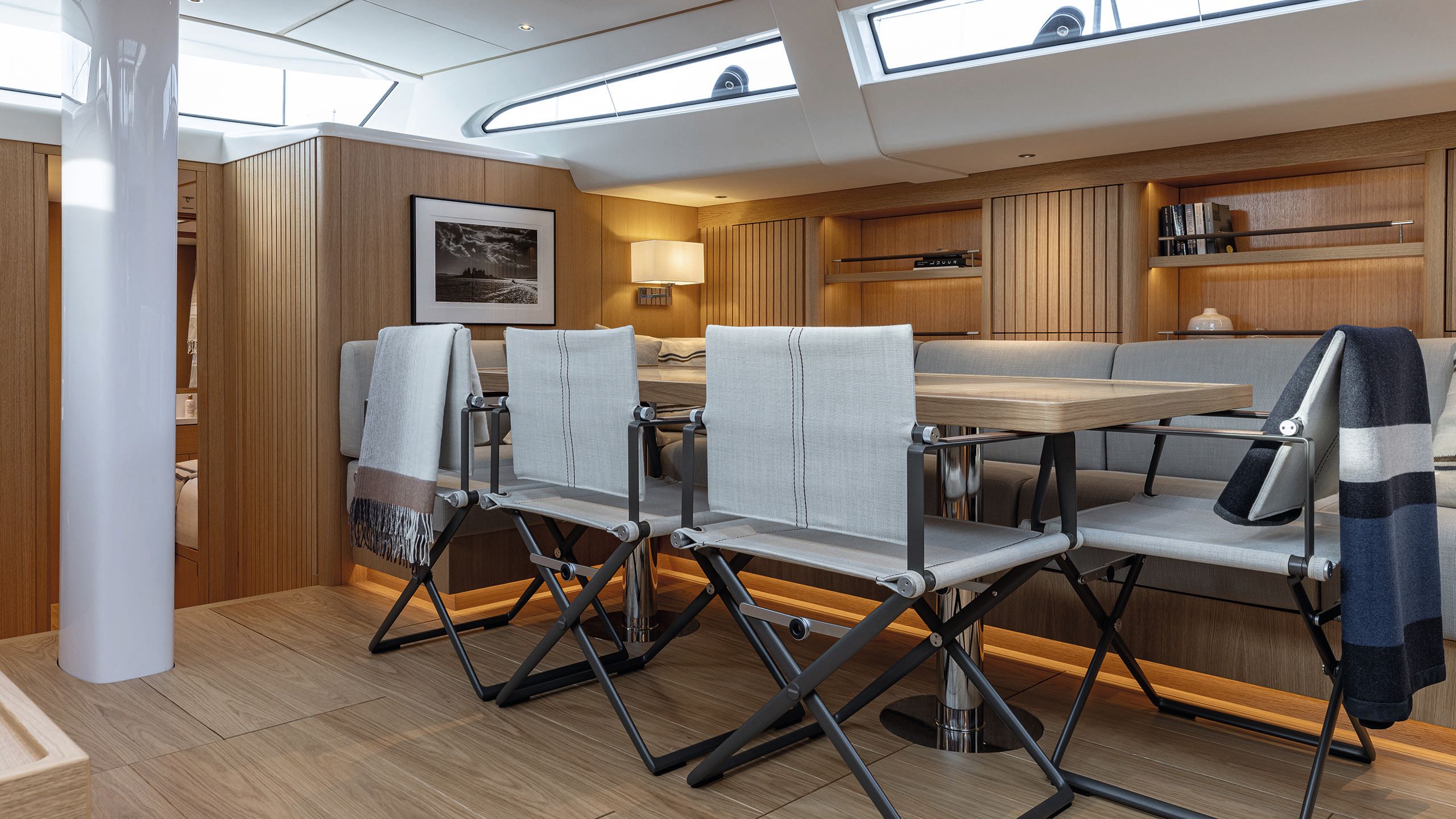 Close-up of grey folding chairs around a dining table