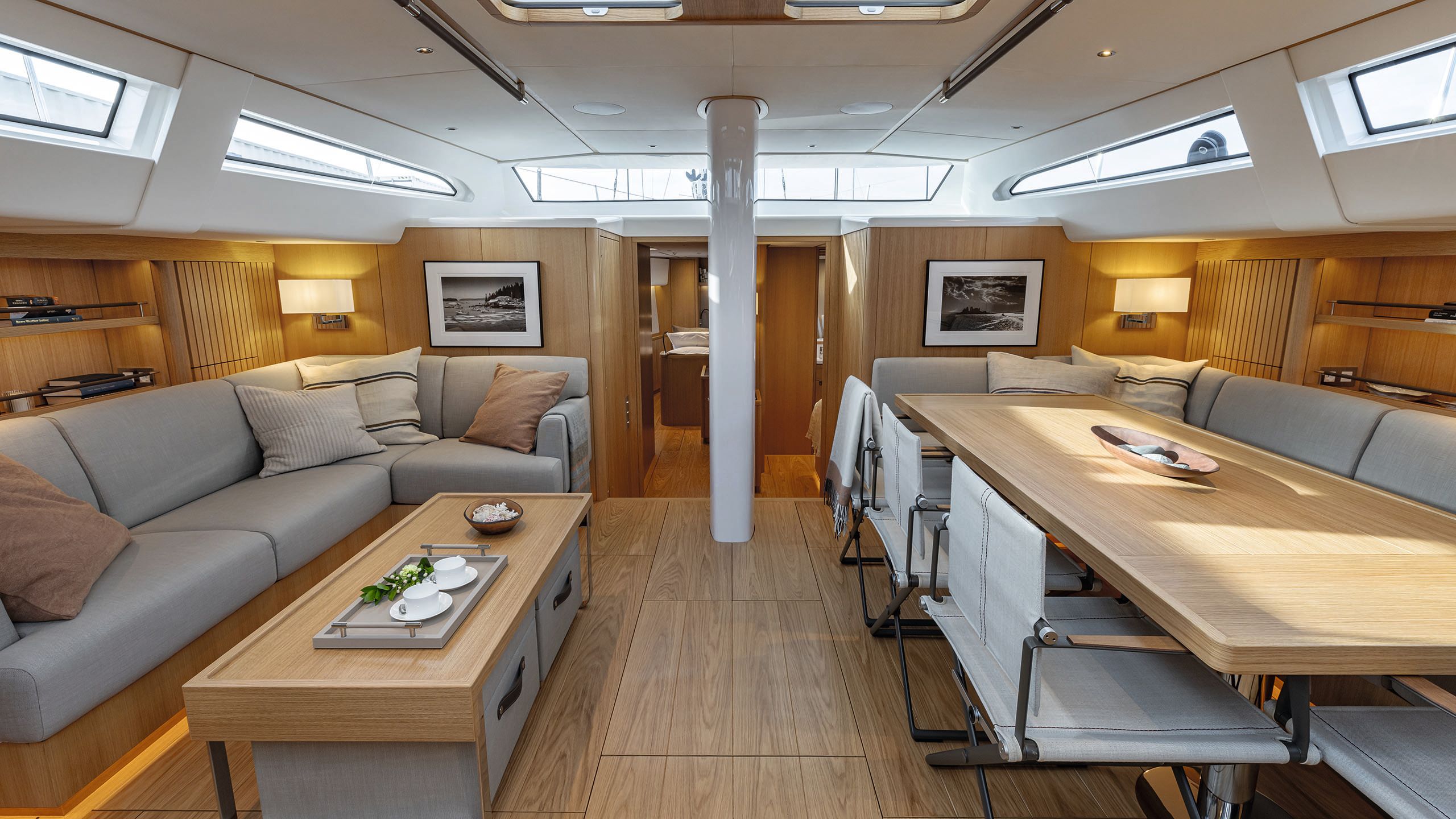 Dining table on the right, L-shape sofa on the left with coffee table in between