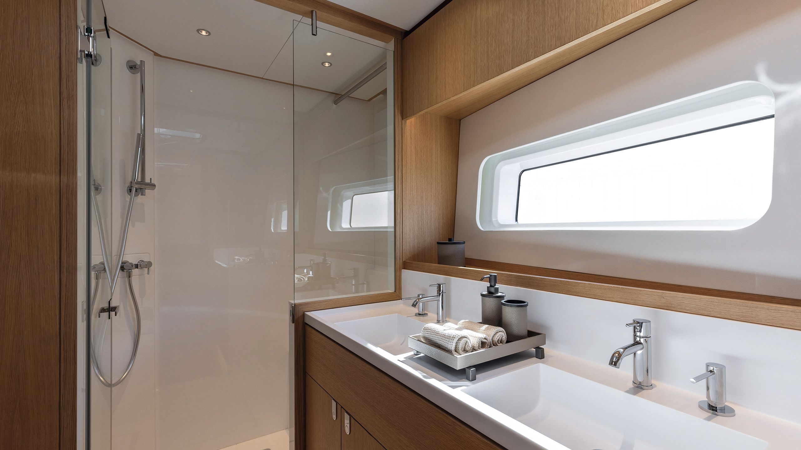 View looking into the en-suite, which has a small white sink and shower