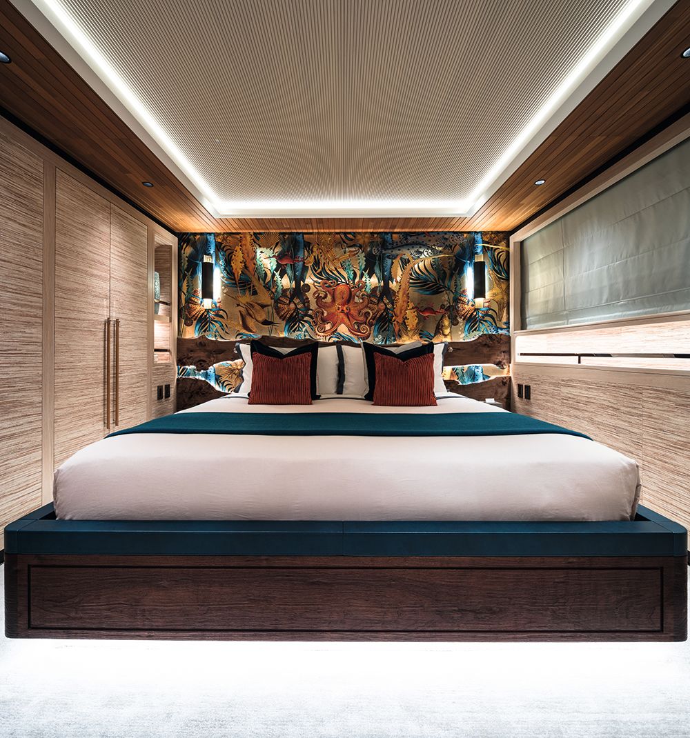 Bedroom with wallpaper behind headboard