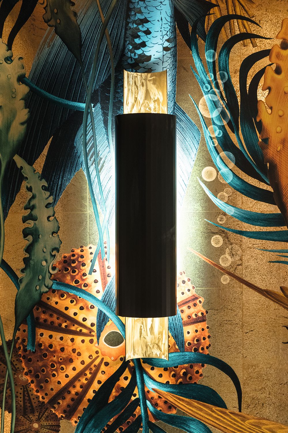 Bespoke lighting with patterned wallpaper behind