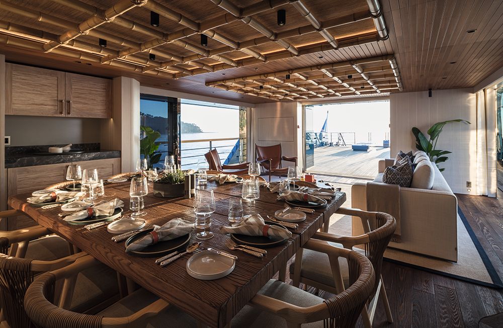 Dining table laid with cutlery and crockery