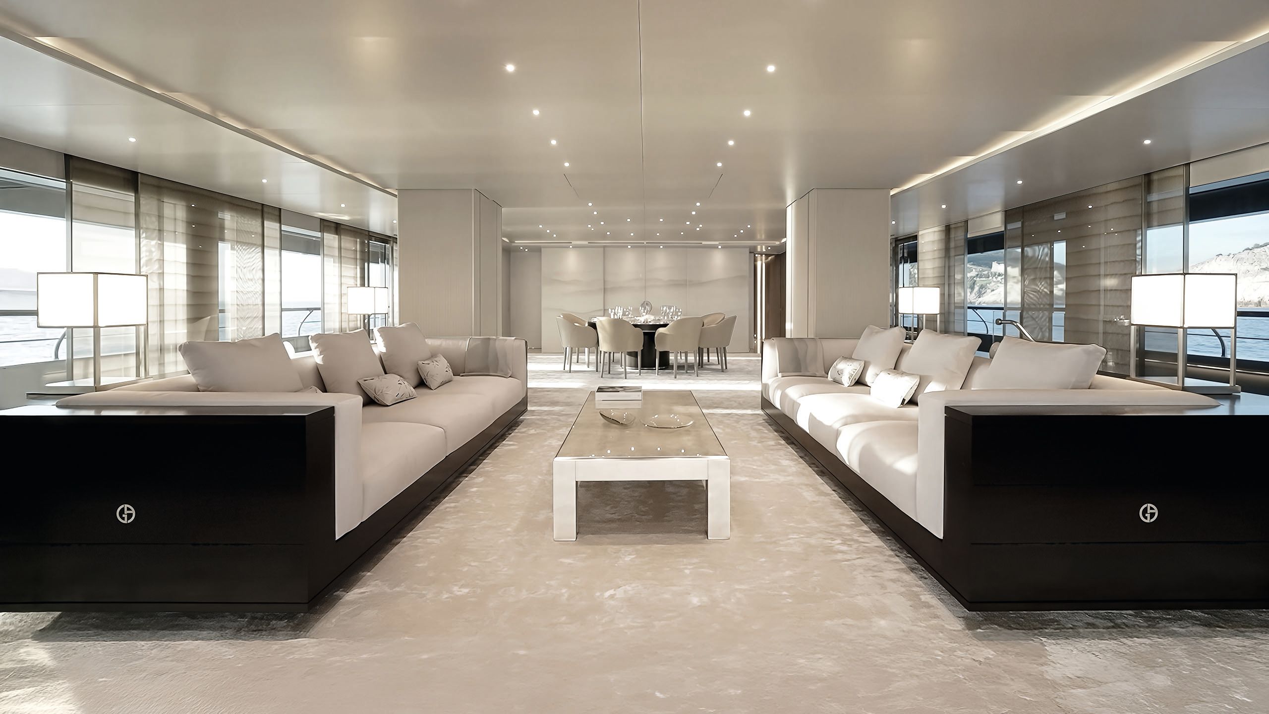 The lounge area is done out in neutral colours with two long sofas facing each other in cream and white with a coffee table in the centre