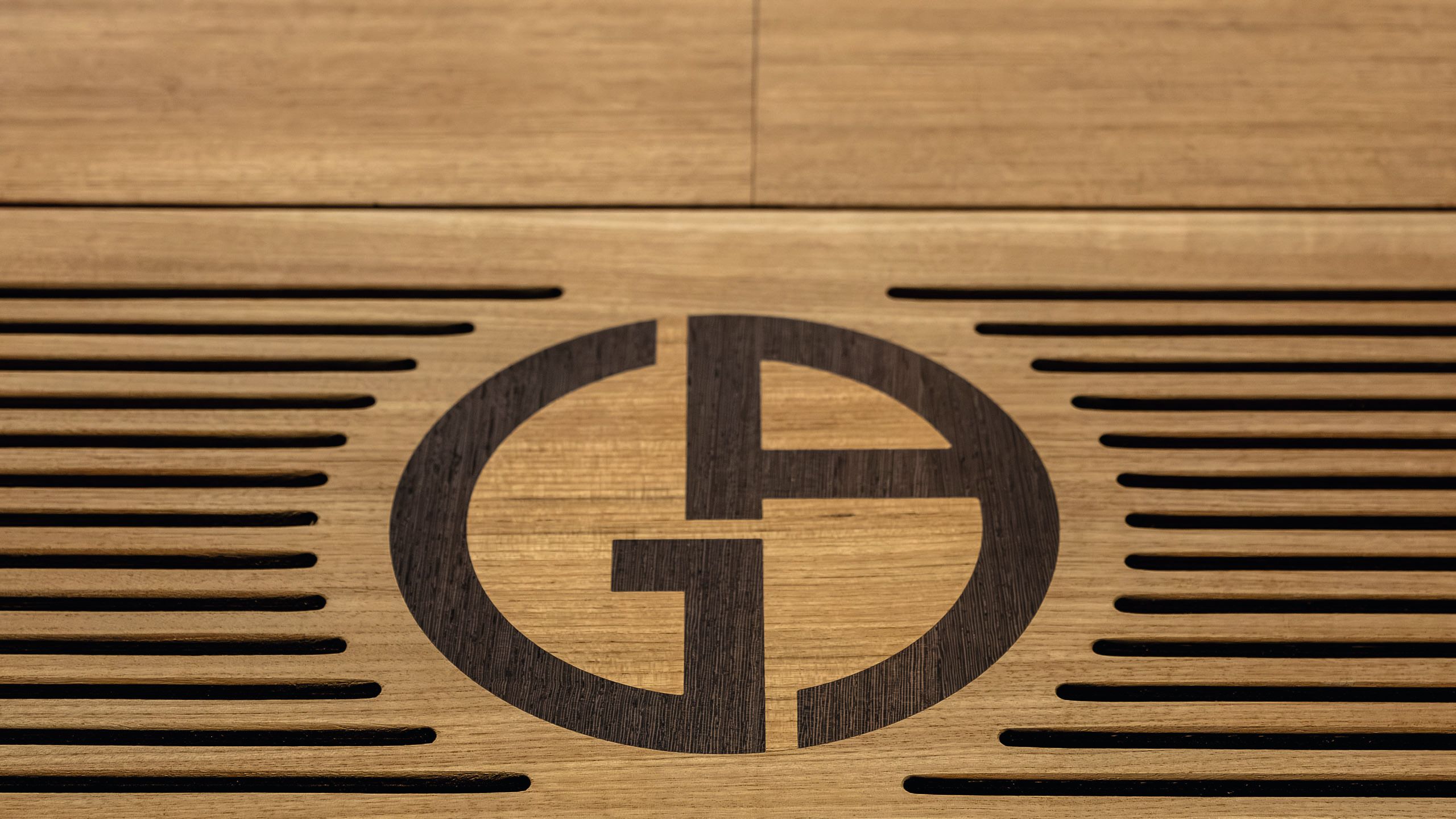 The Armani logo engrained in wood