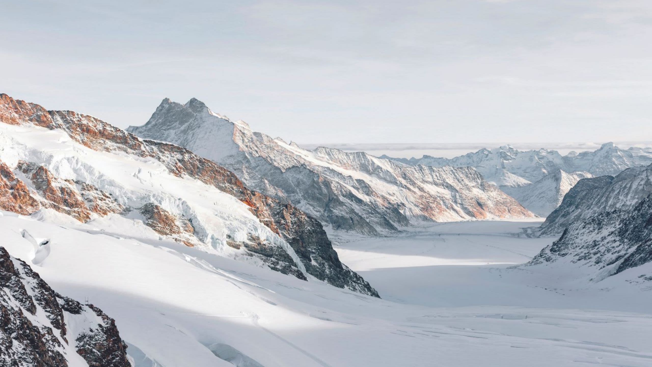 Background image showing snowy mountains
