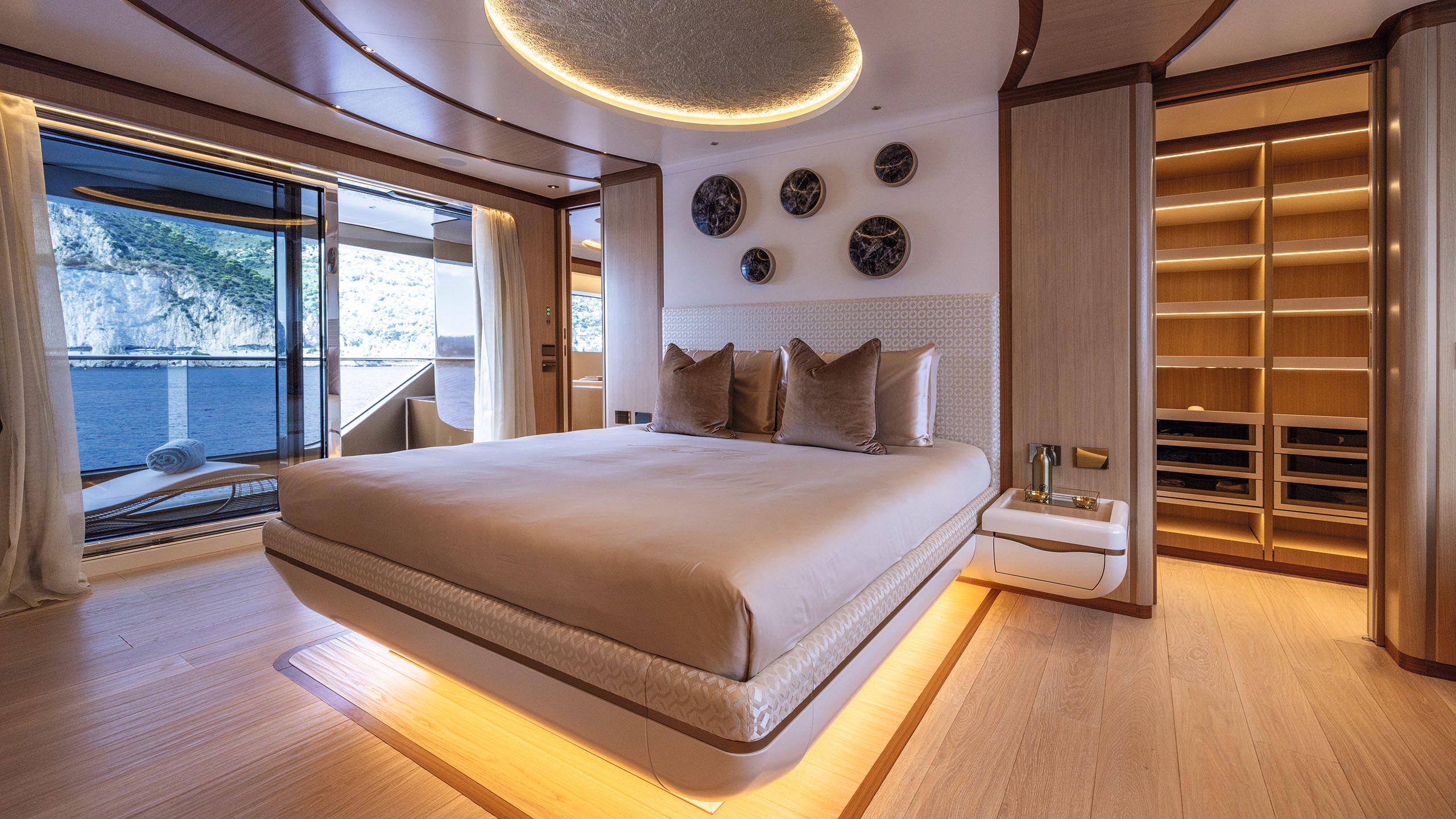 Inside the bedroom, which is done in mushroom and neutral colours with warm lighting