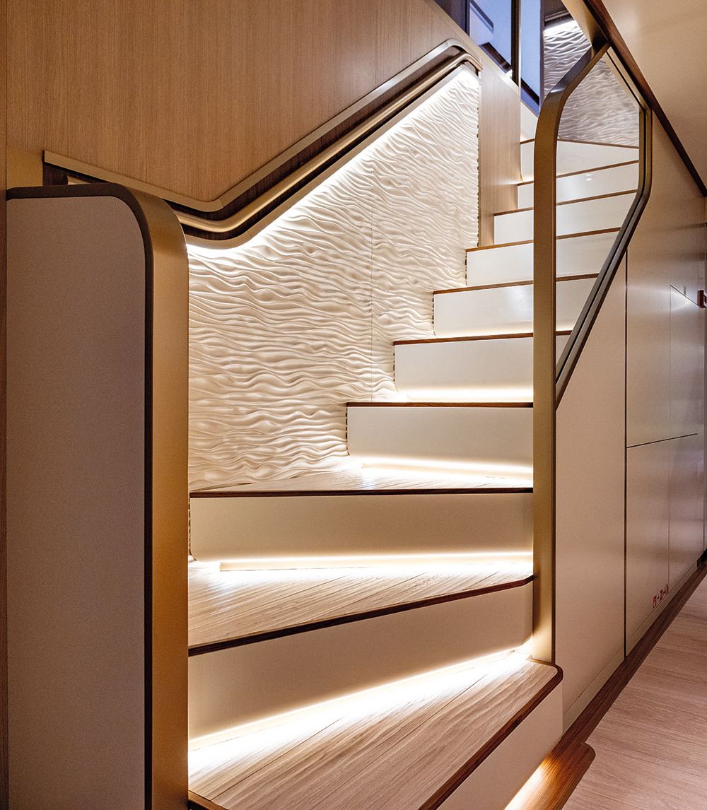 Looking up a staircase with treads lit from underneath