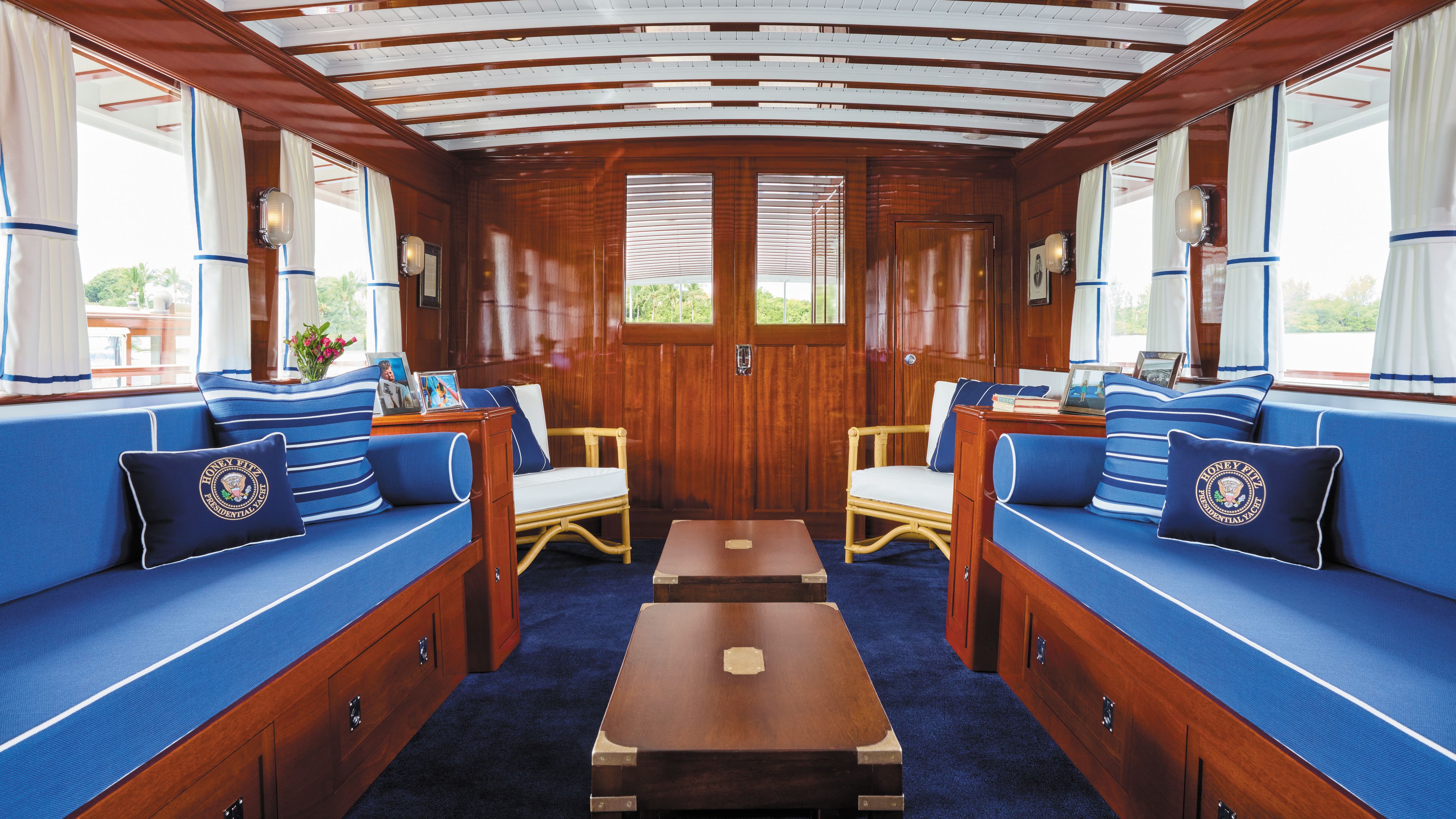 A colour photo showing the same lounge area - the decor has been updated with bamboo furniture