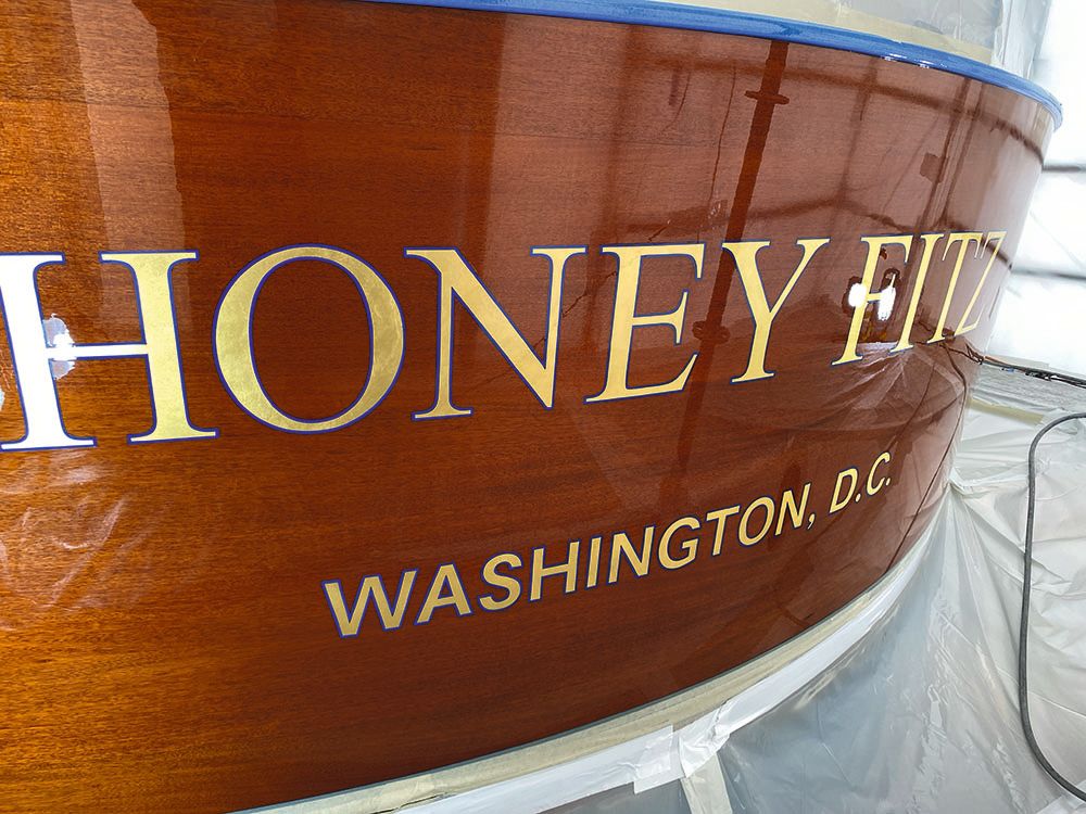 Close-up of the words Honey Fitz in gold on the wood