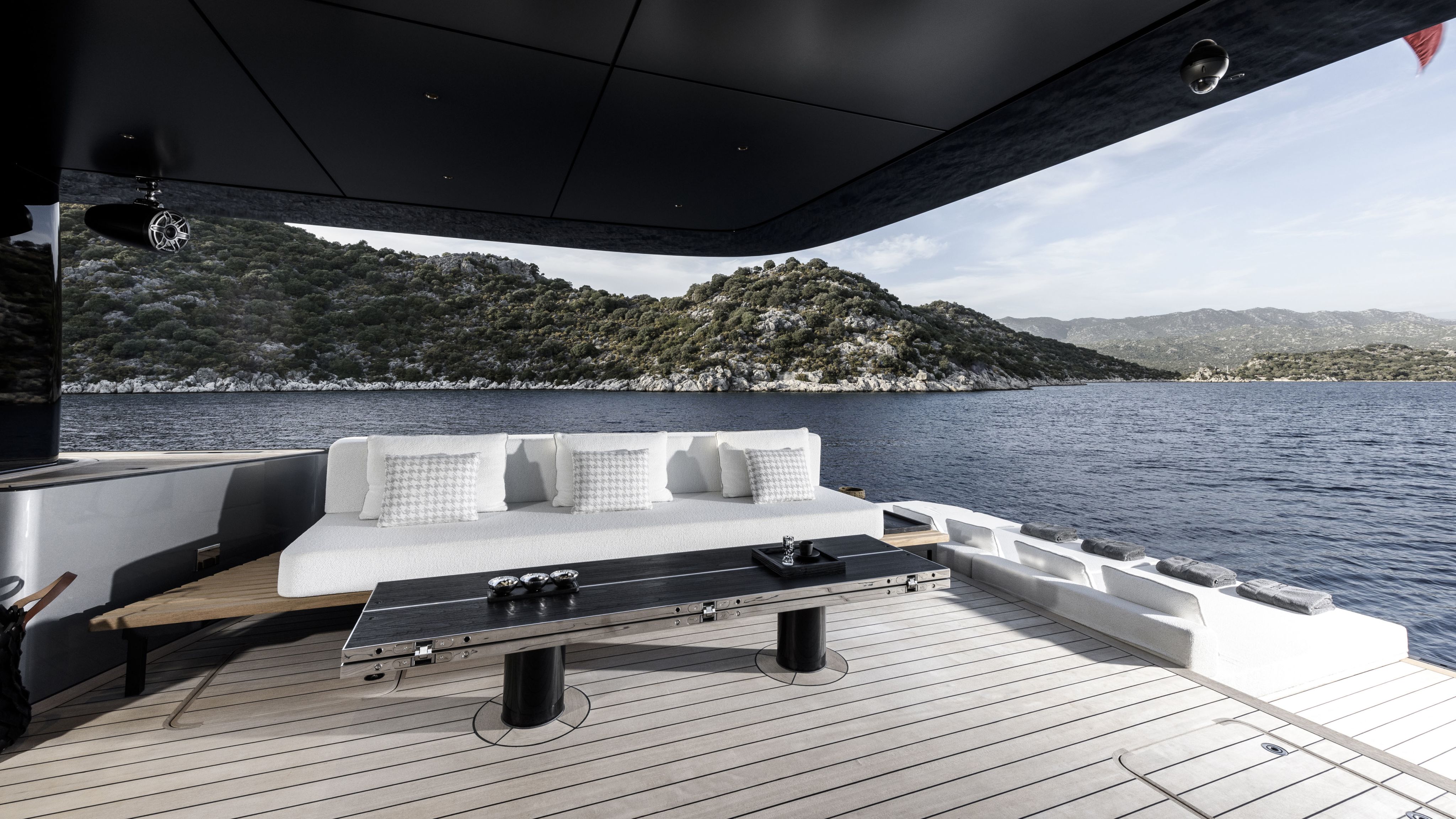 Covered outdoor deck with white sofas