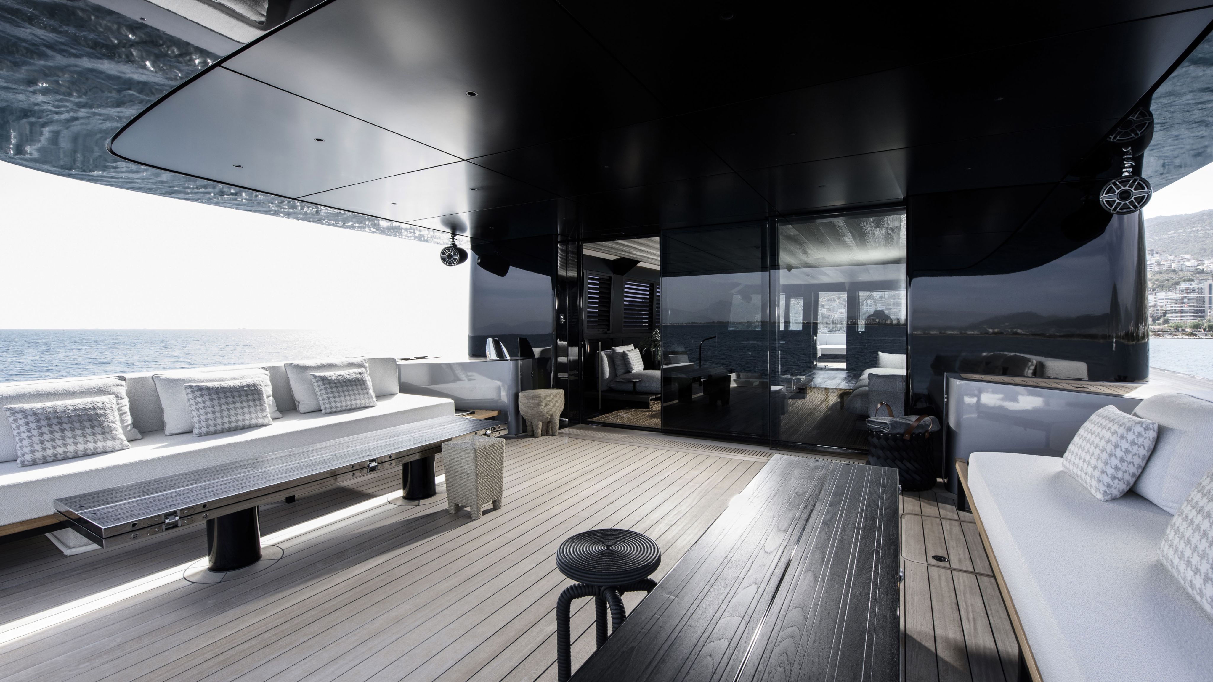 Alt view of covered outdoor deck with white sofas