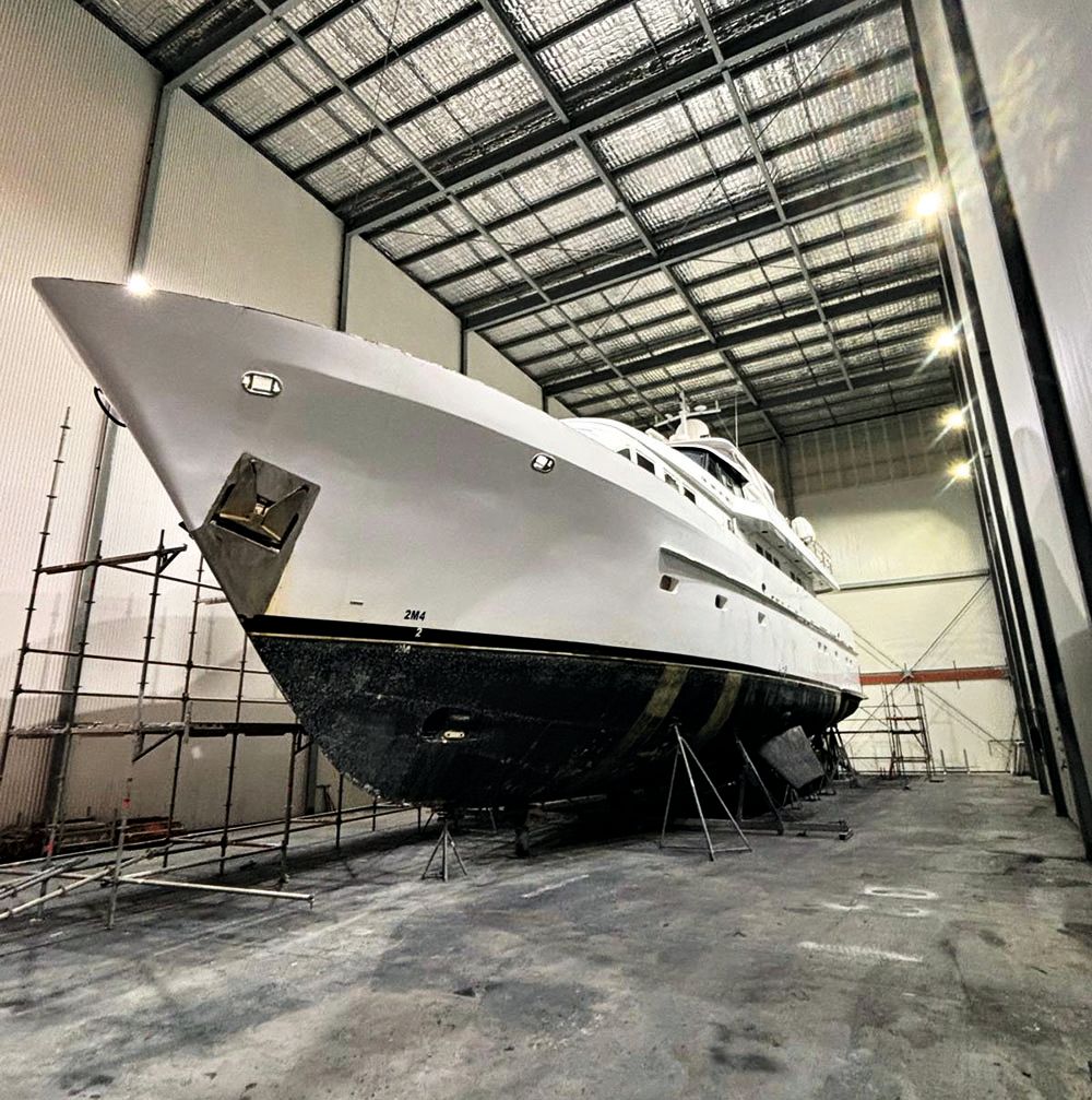 Sea Raes in the yard, surrounded by scaffolding