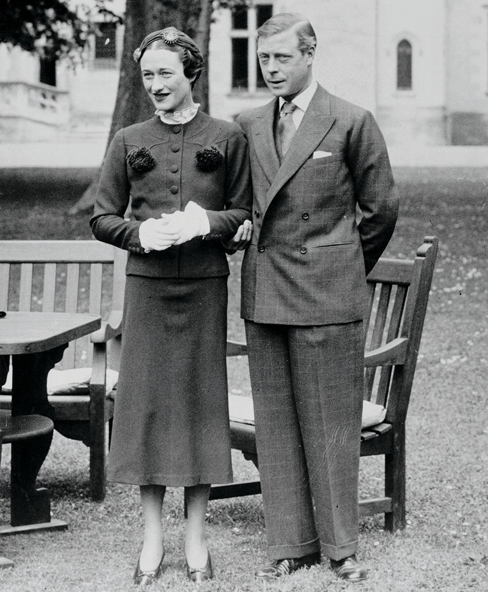 Black and white photo of Wallis Simpson and Prince Edward standing on a lawn