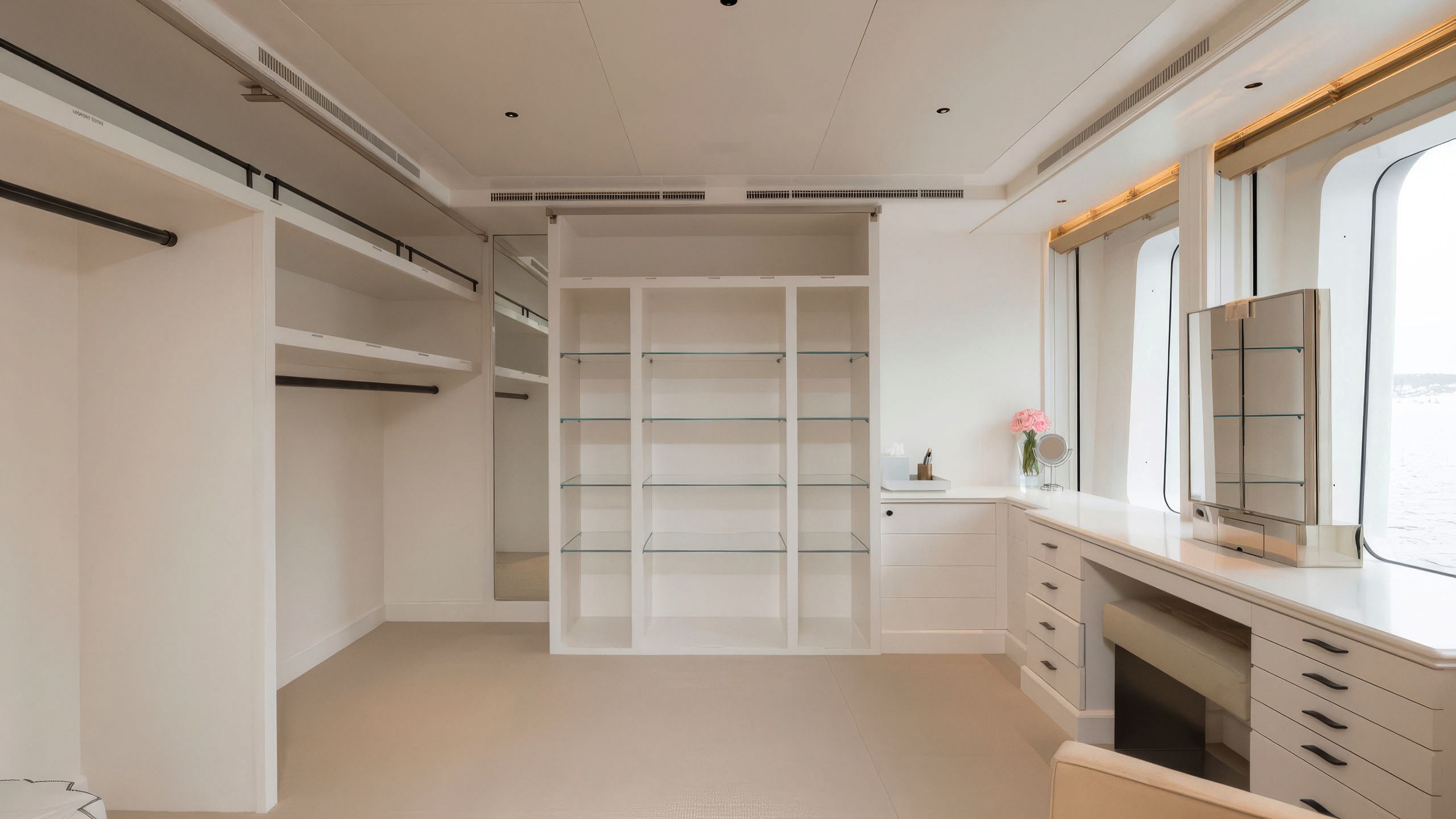 The spa area used to be a large walk-in closet space done entirely in white and glass
