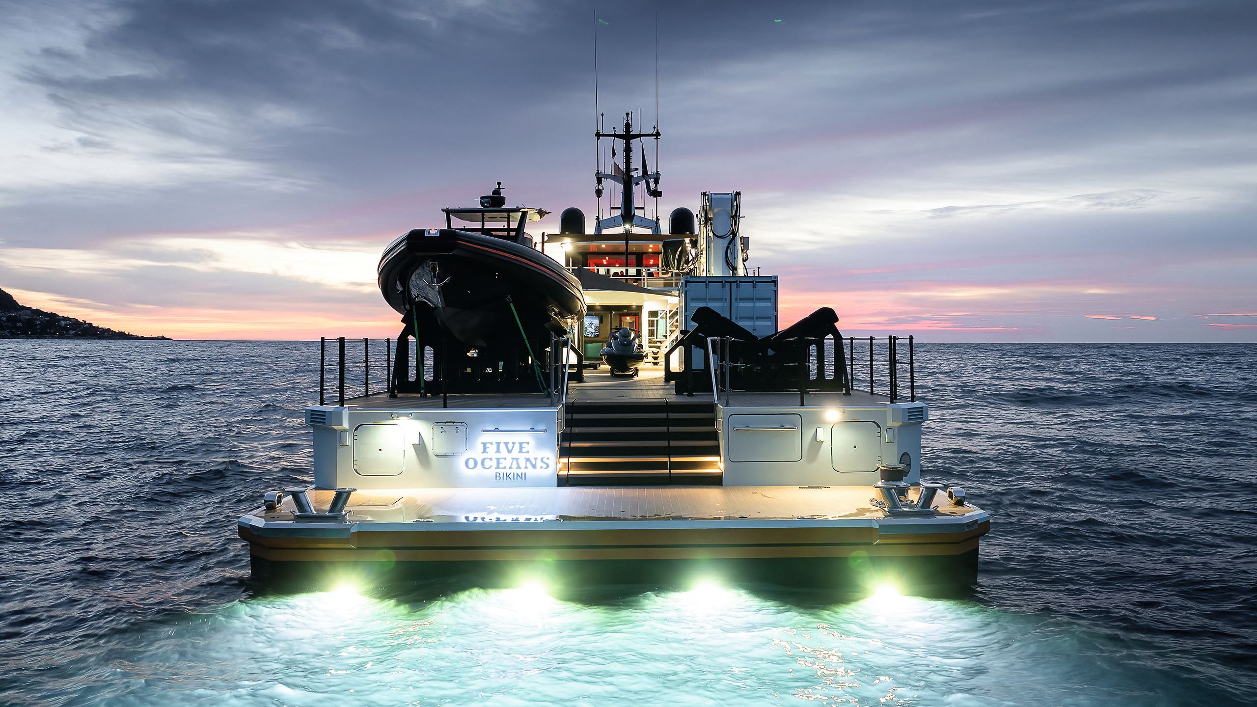 Five Oceans from the back at night on the water