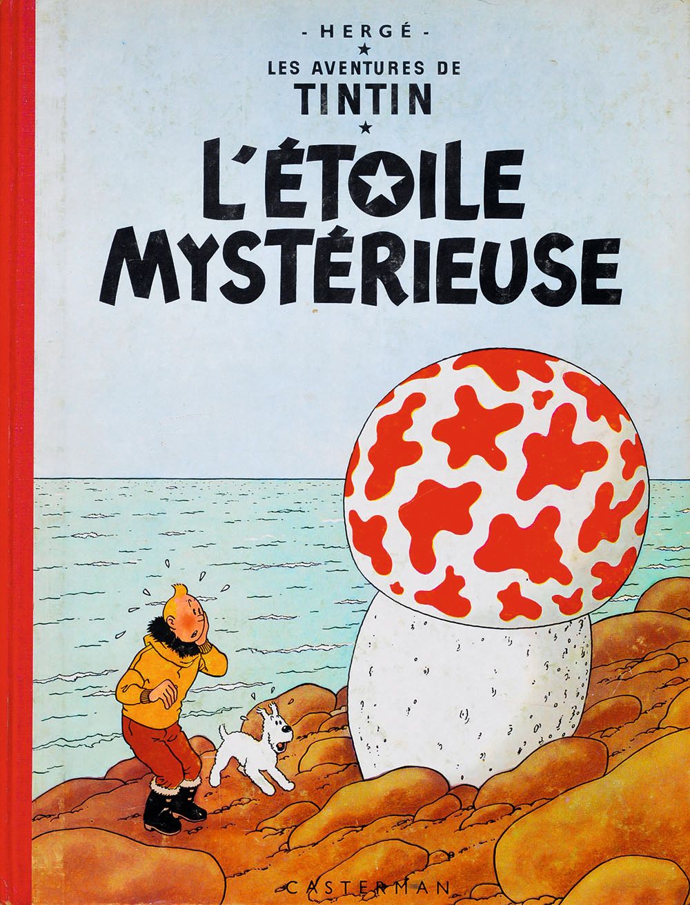 An old copy of a TinTin book called "l'etoile mysterieuse"