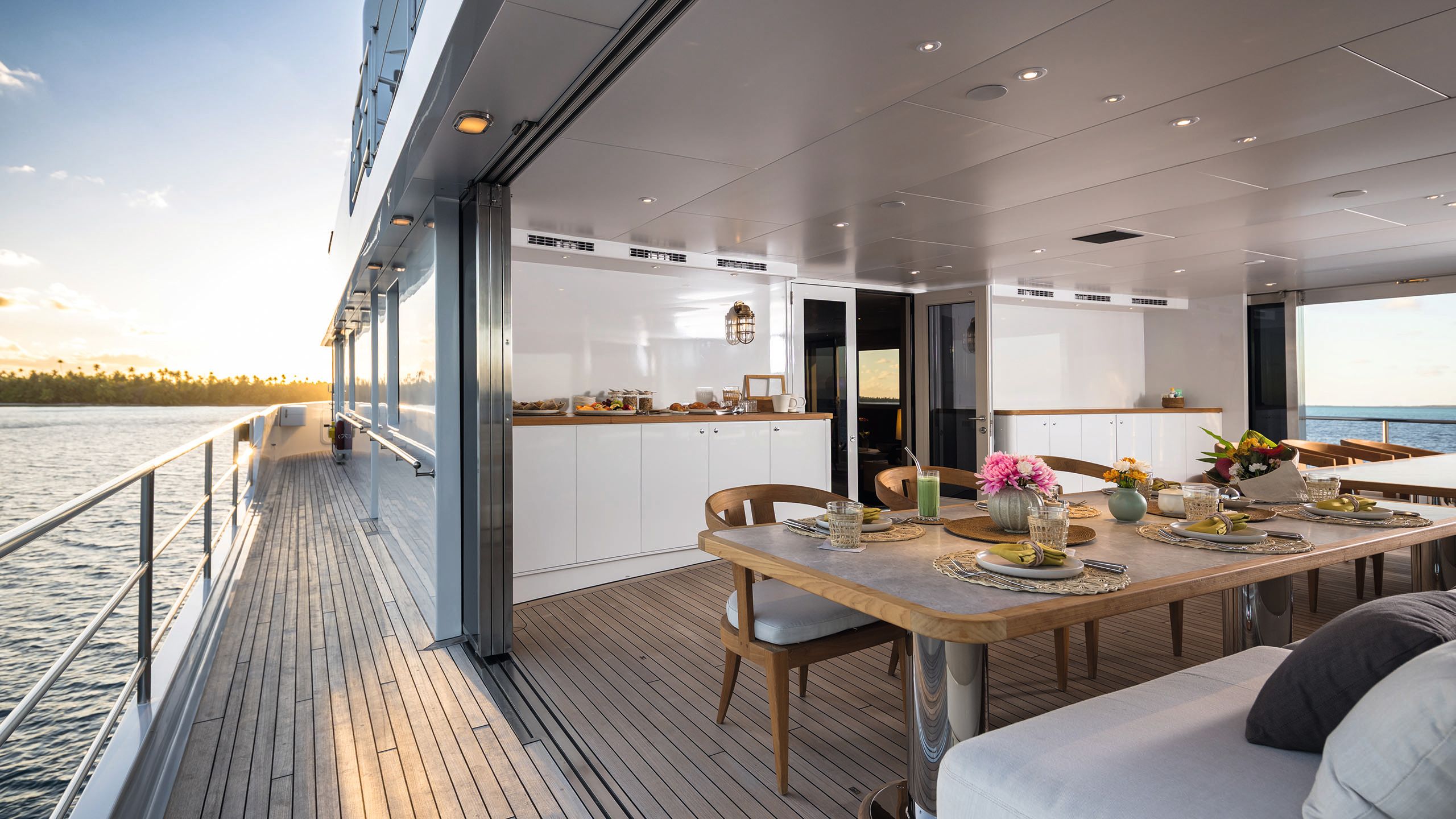 Looking into a dining area which has sliding doors opening on to the deck