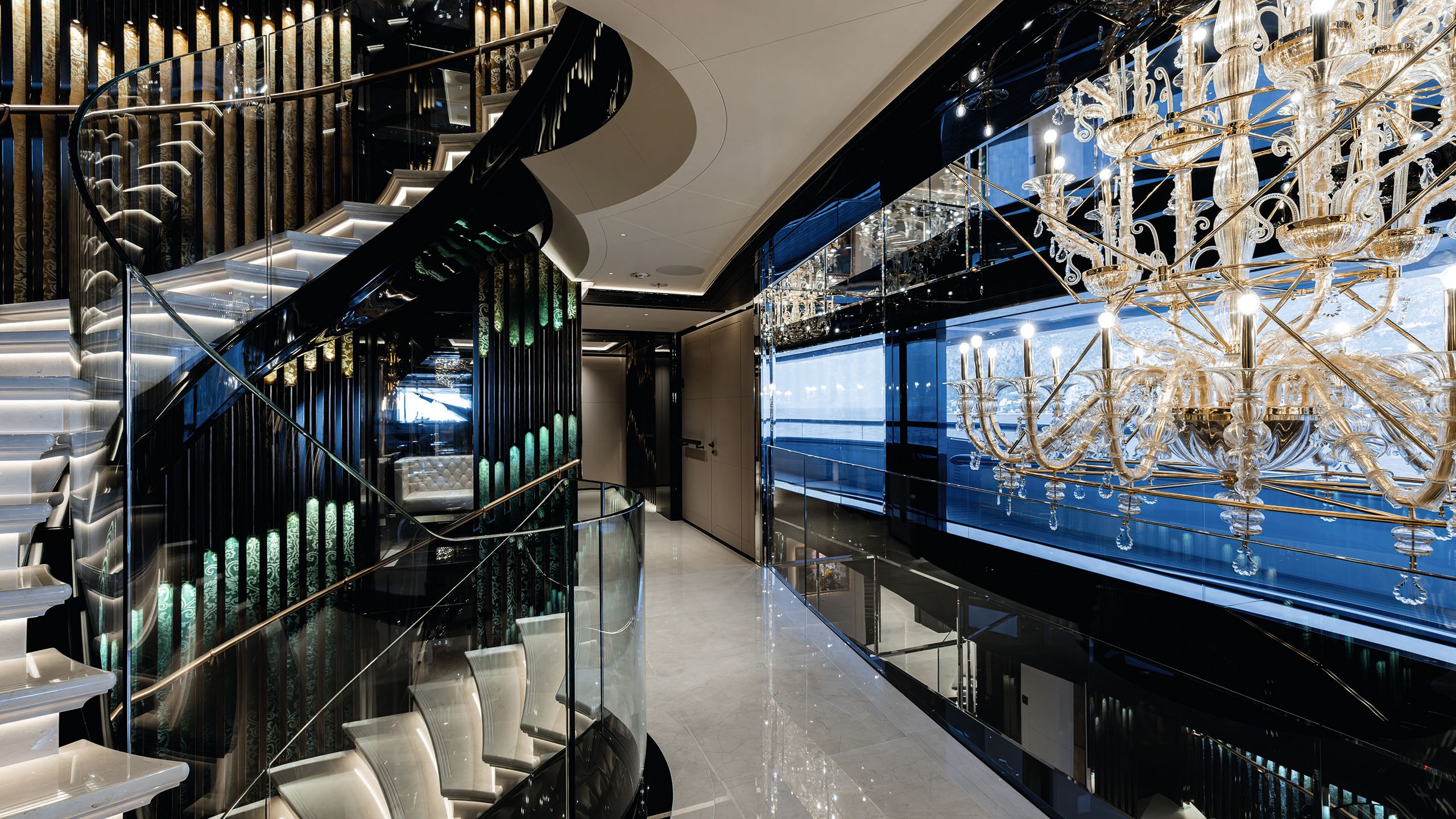 Spiral staircase with white treads and black and blue walls. The surfaces are glossy