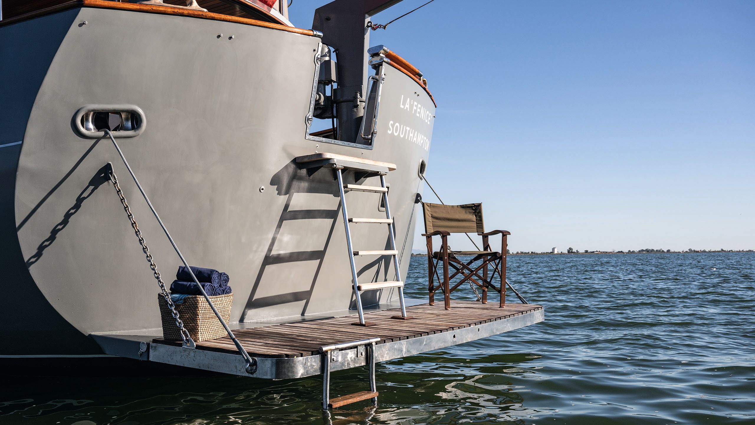 Swim platform accessible from the deck via a ladder