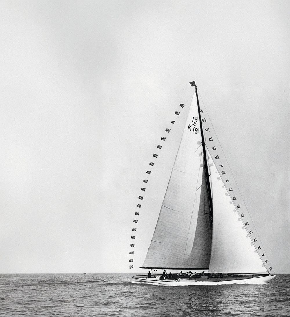 Black and white photo of Flica, a boat with large white sails