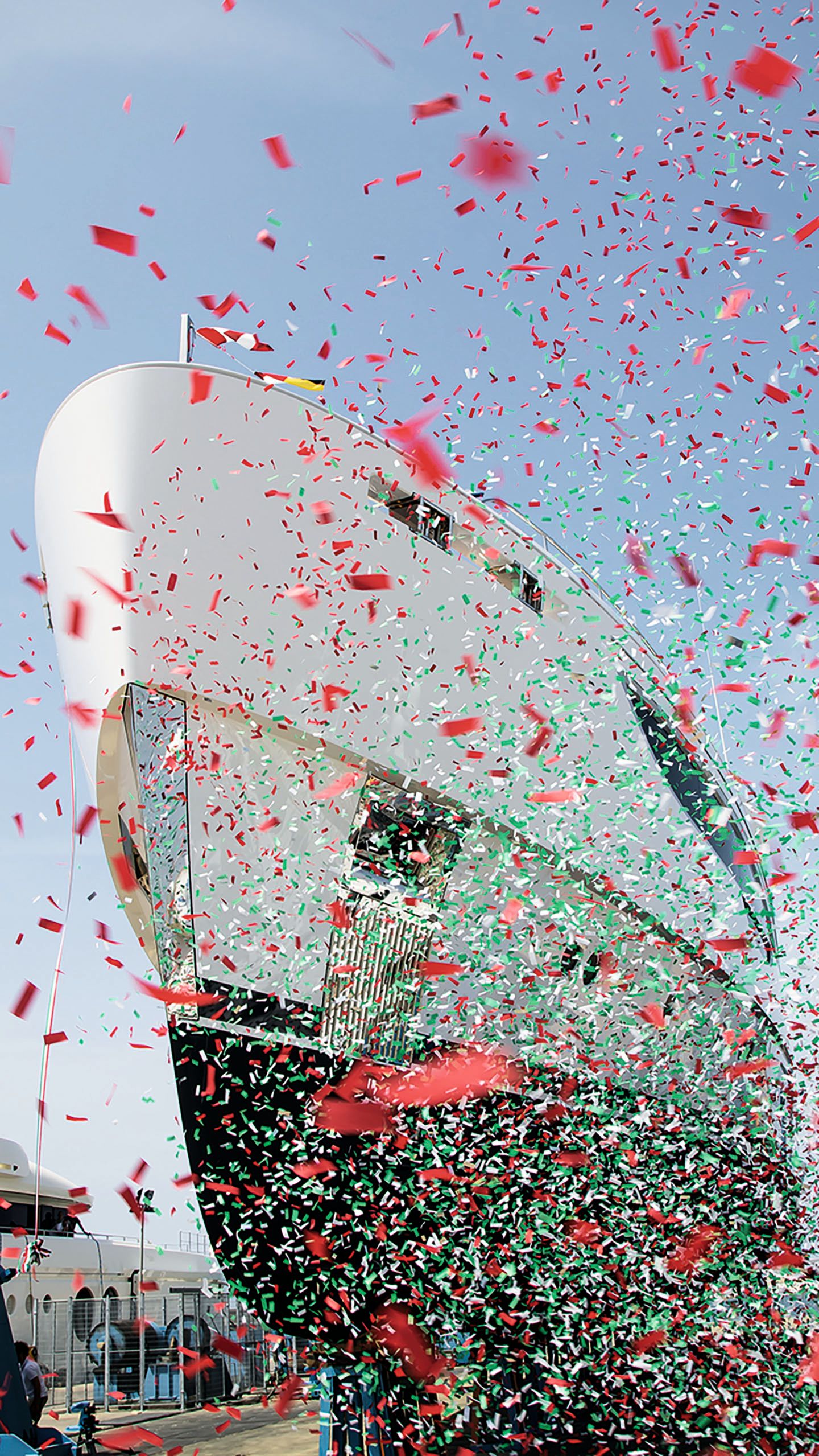 Front view of Maverick with pink, white and green confetti fluttering in the foreground