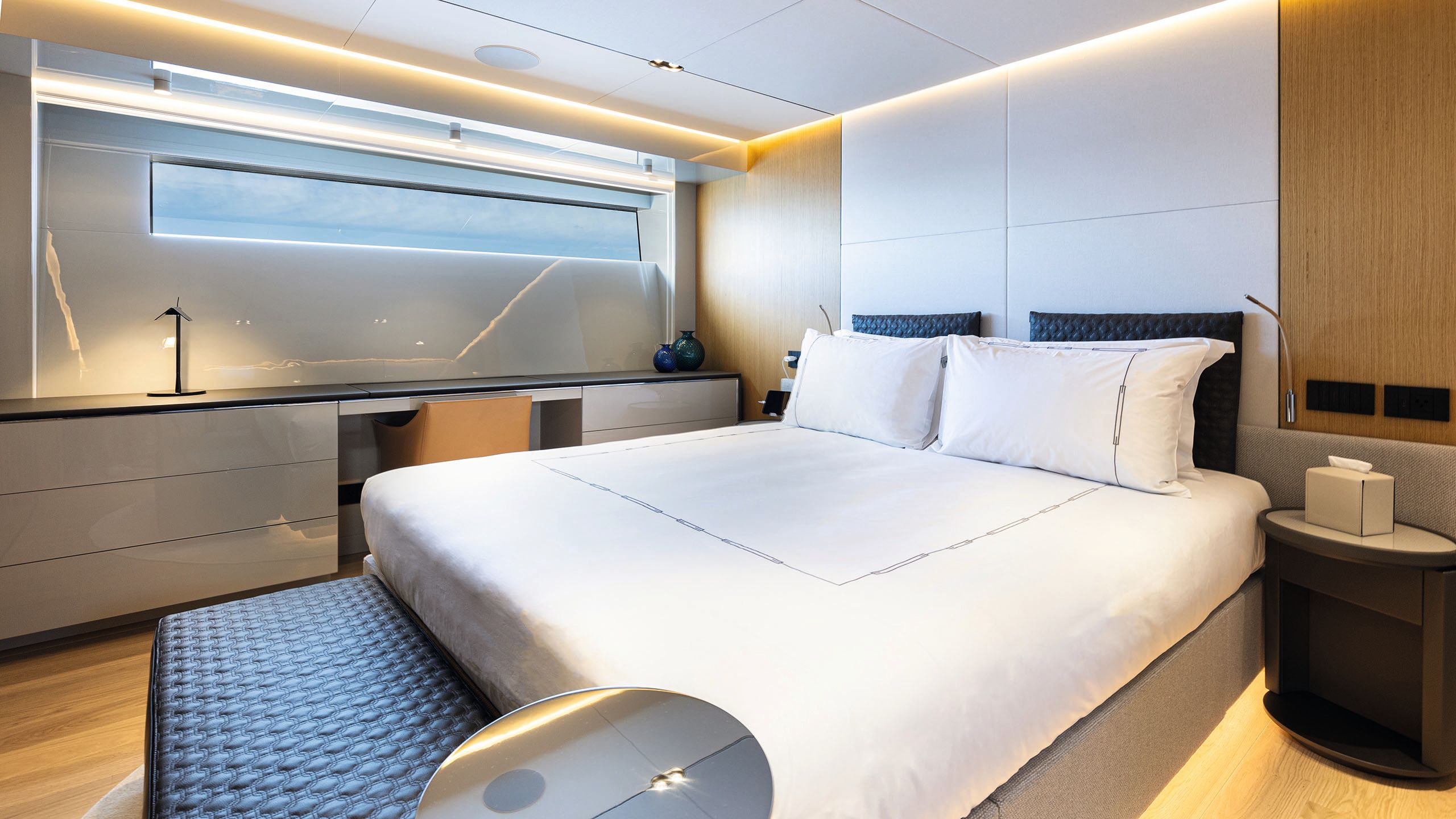 Large bed with white bedding and pillows