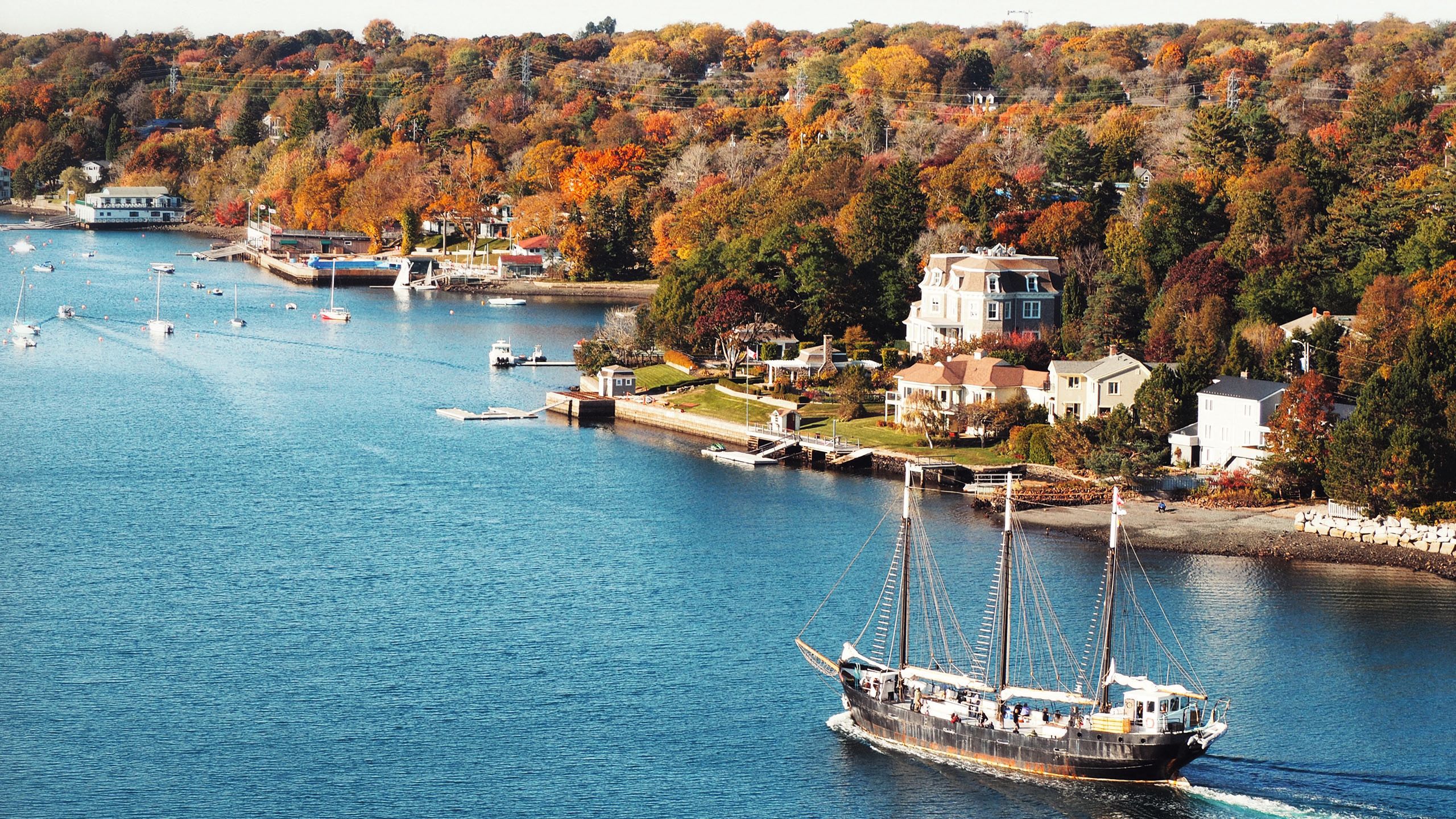 View of boat and houses on shoreline 