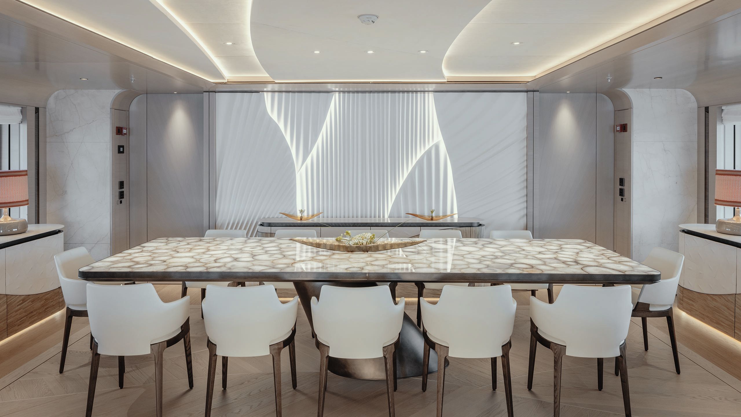 Side view of agate table with five chairs either side and one at each end