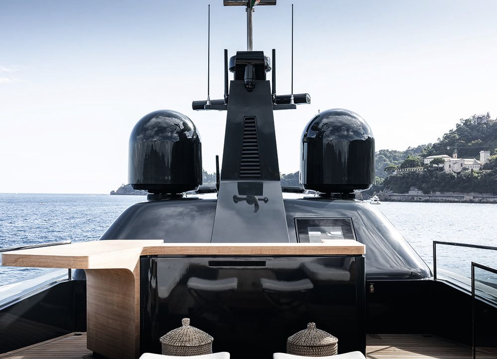 Close-up of the bar from the front, which has a glossy black front and wooden top