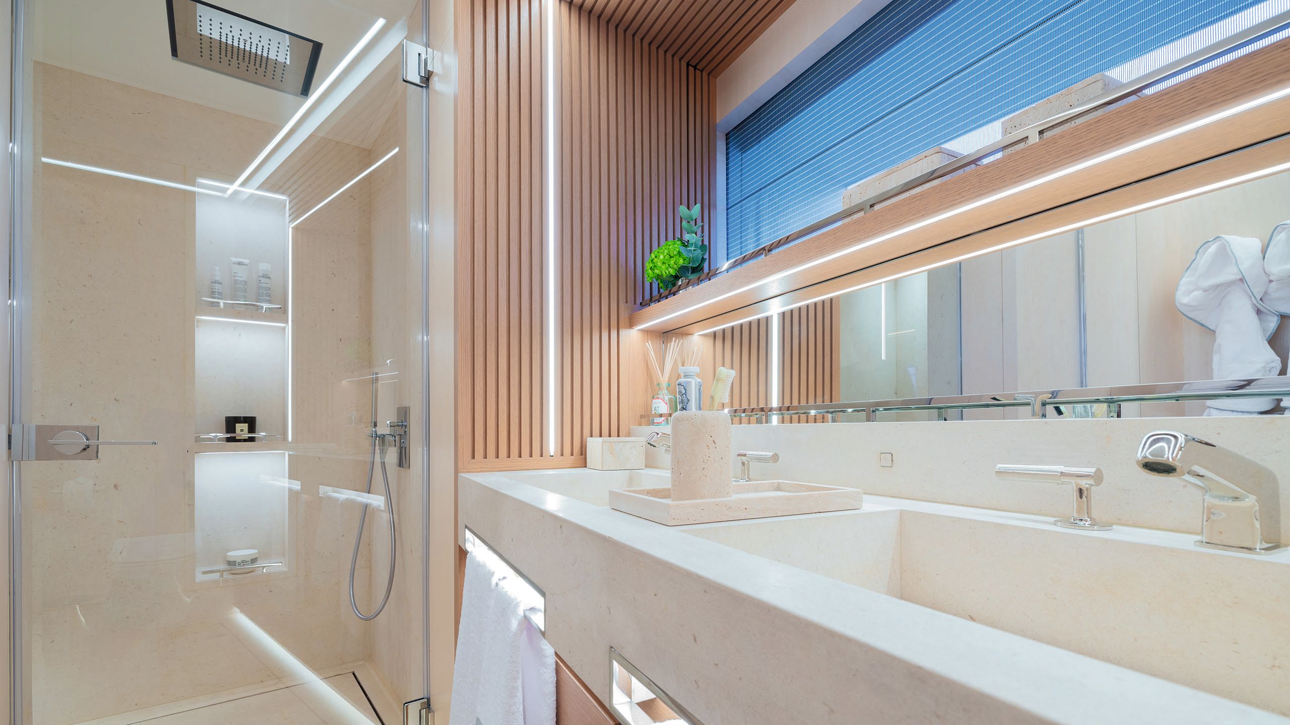 Bathroom area in pale wood and neutral colours