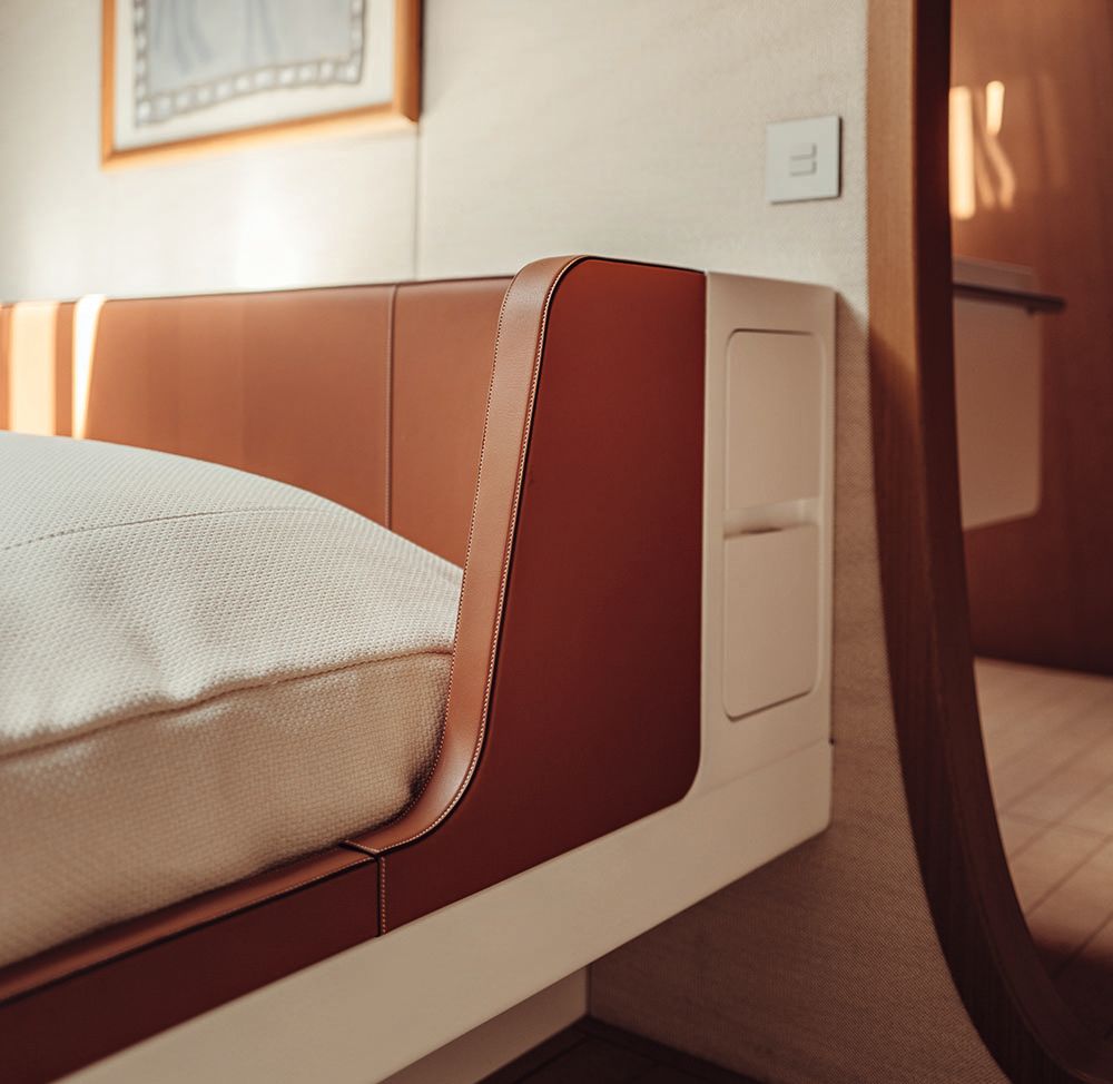 Close-up of tan leather detailing on a headboard