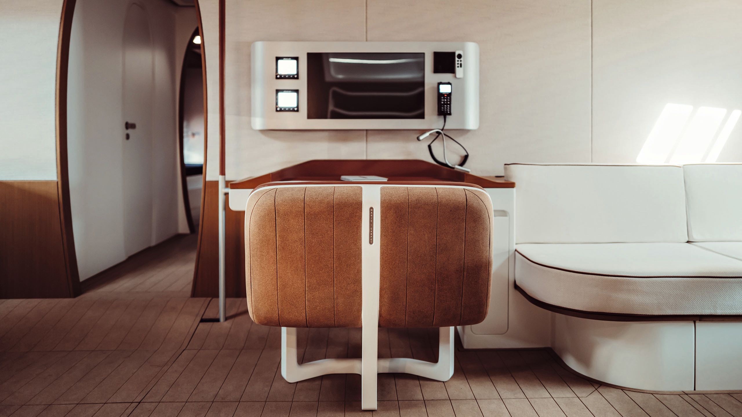 Looking face on at a control panel with back of a chair in the foreground