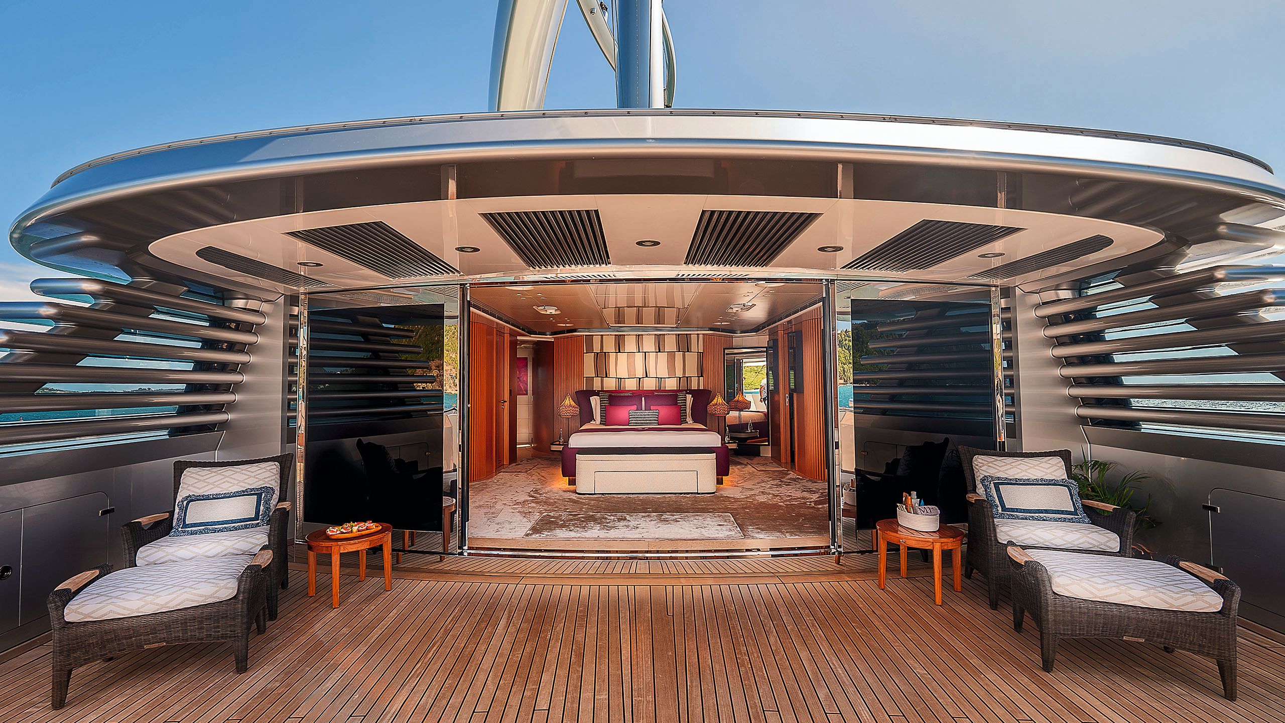 Looking into the VIP cabin from the deck, which has cushioned sun loungers either side of the sliding doors