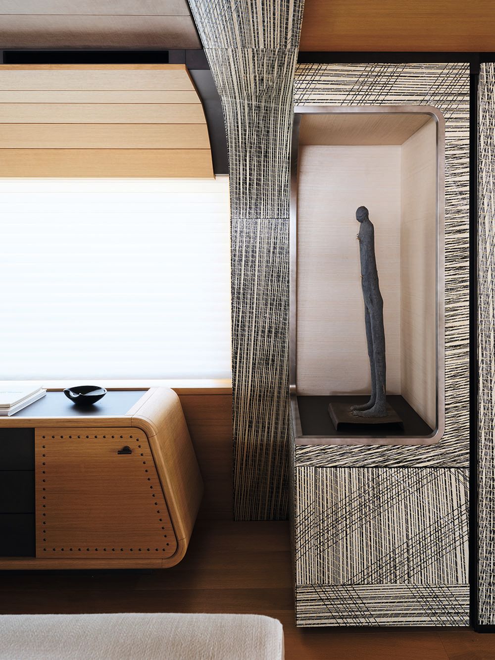 Abstract close-up of the edge of a desk and the bottom of a statute