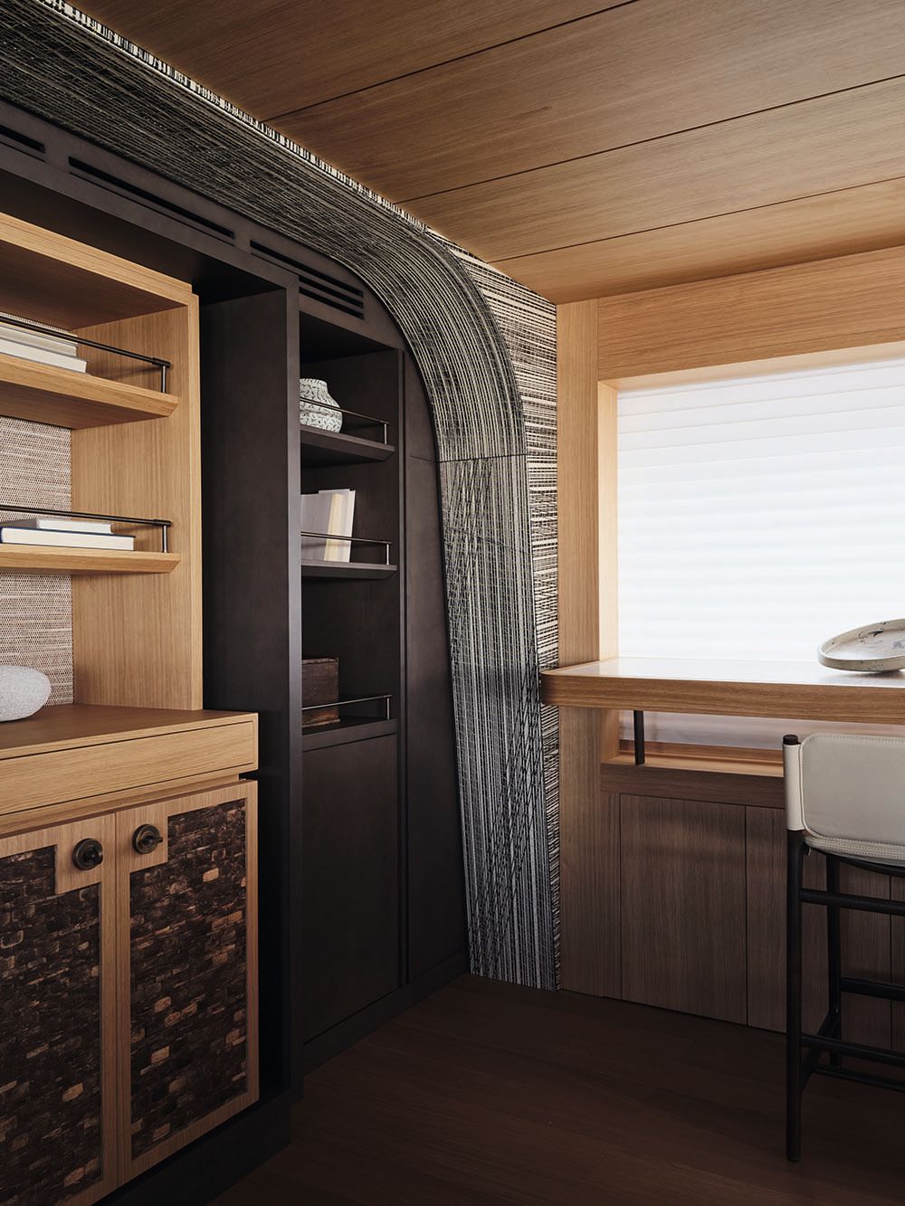 Shelving and a desk in both light and dark woods