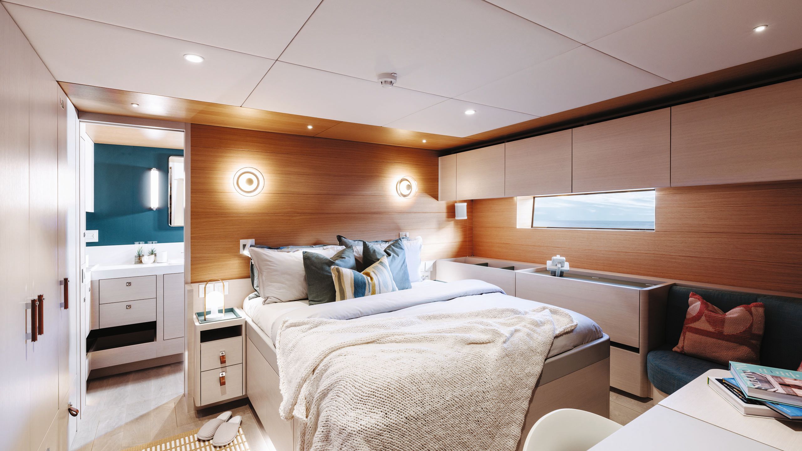 Owner's suite done in neutral colours with teal accents