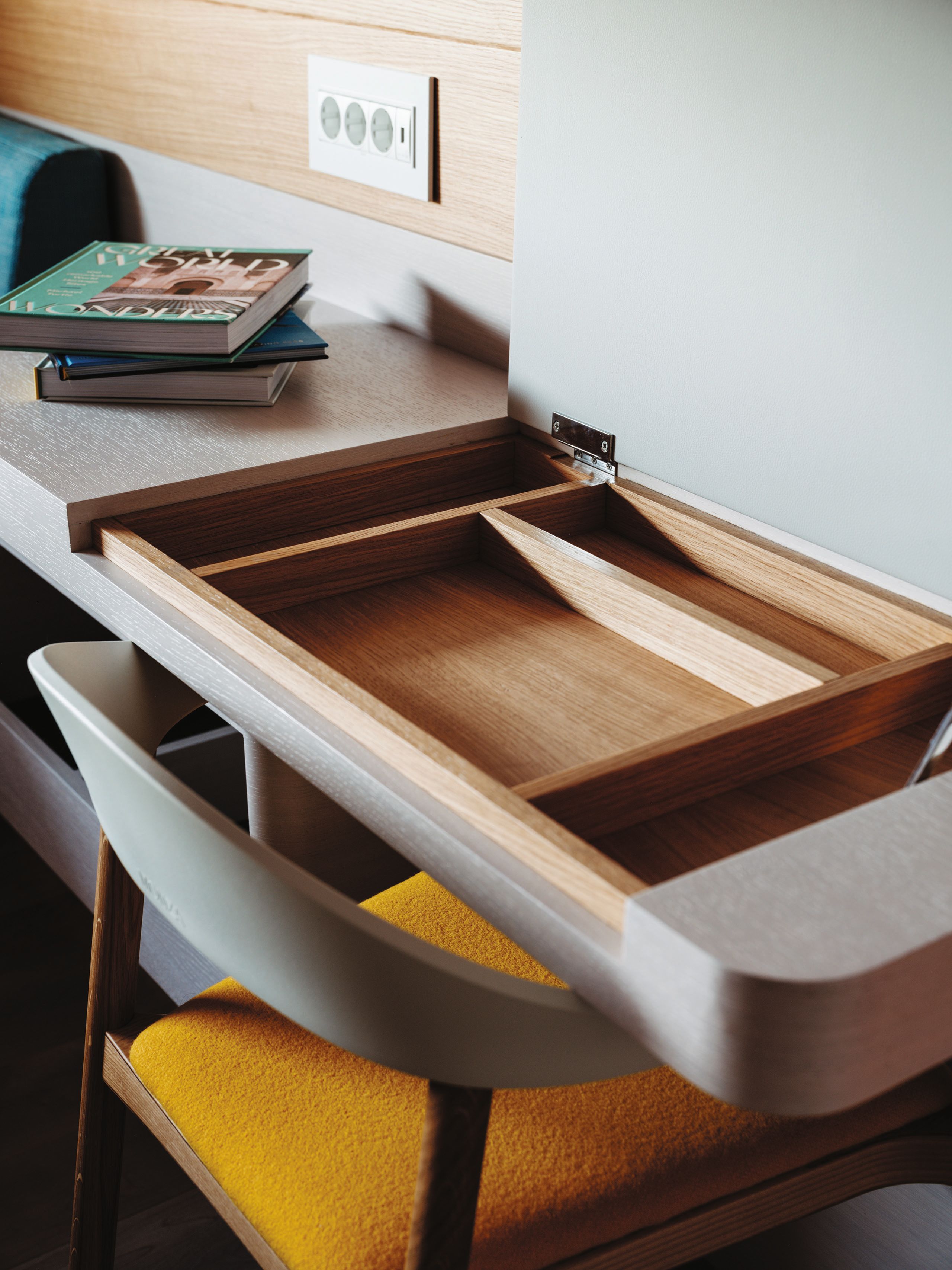 A desk with compartments on the top