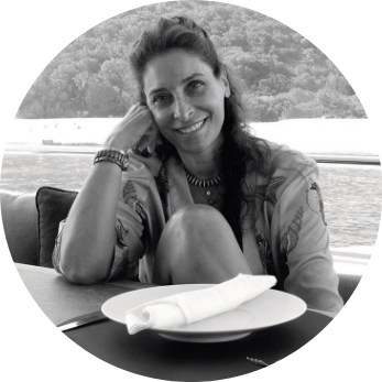 Black and white head and shoulders shot of Ionna Elena Markou in a circular frame